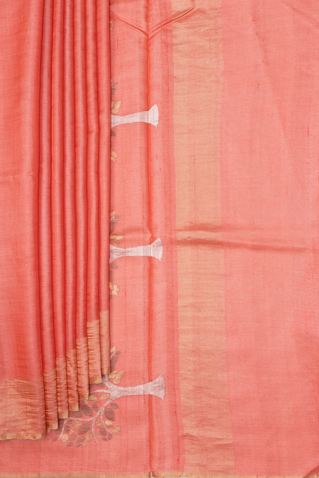 Pleats and pallu of Peach Tussar Silk Saree with Plain Body and Zari Border. 