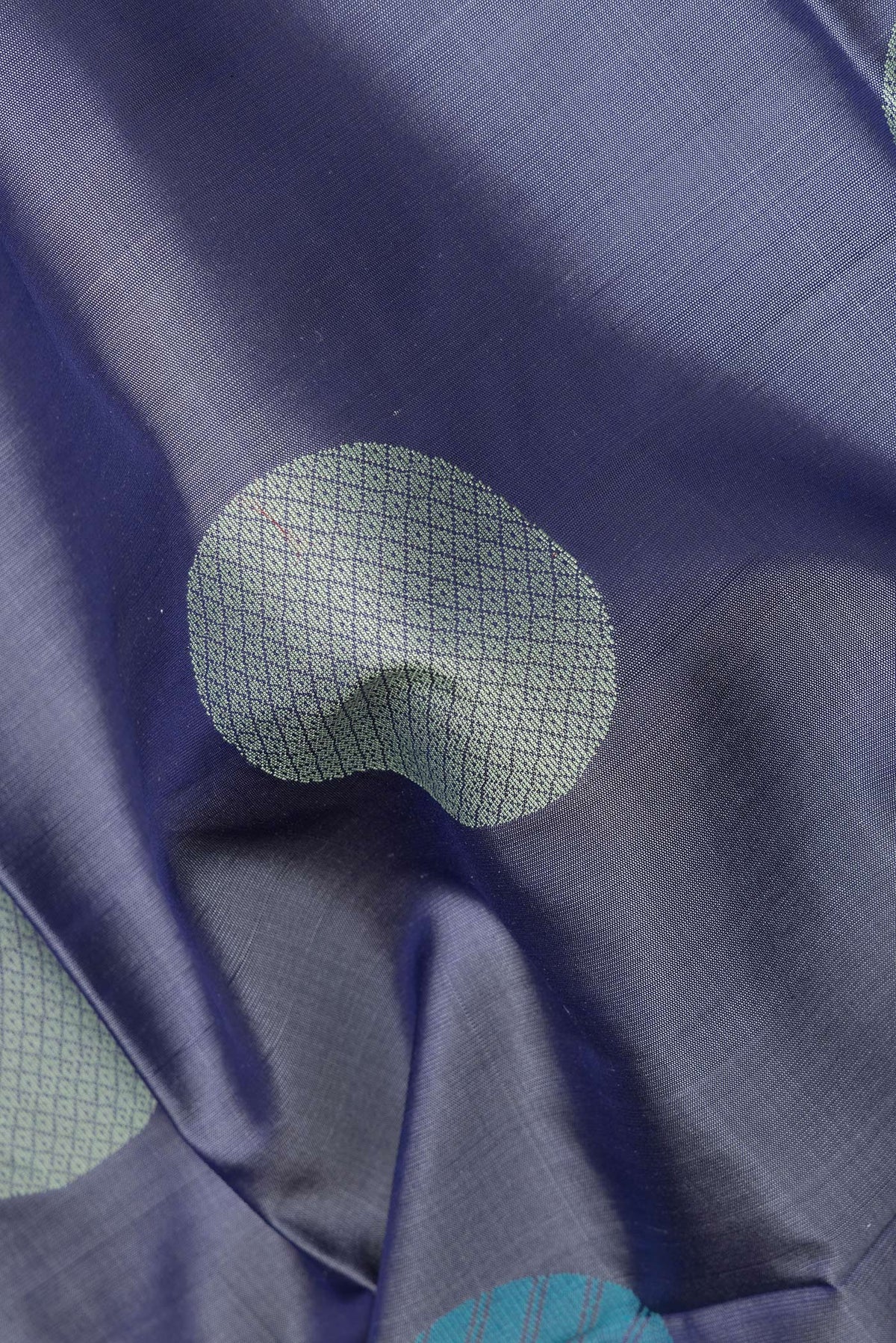 Close up of Pure Silk Maya Blue Dual Tone Soft Saree with Thread Butta on the body and Without Border.  displaying folds