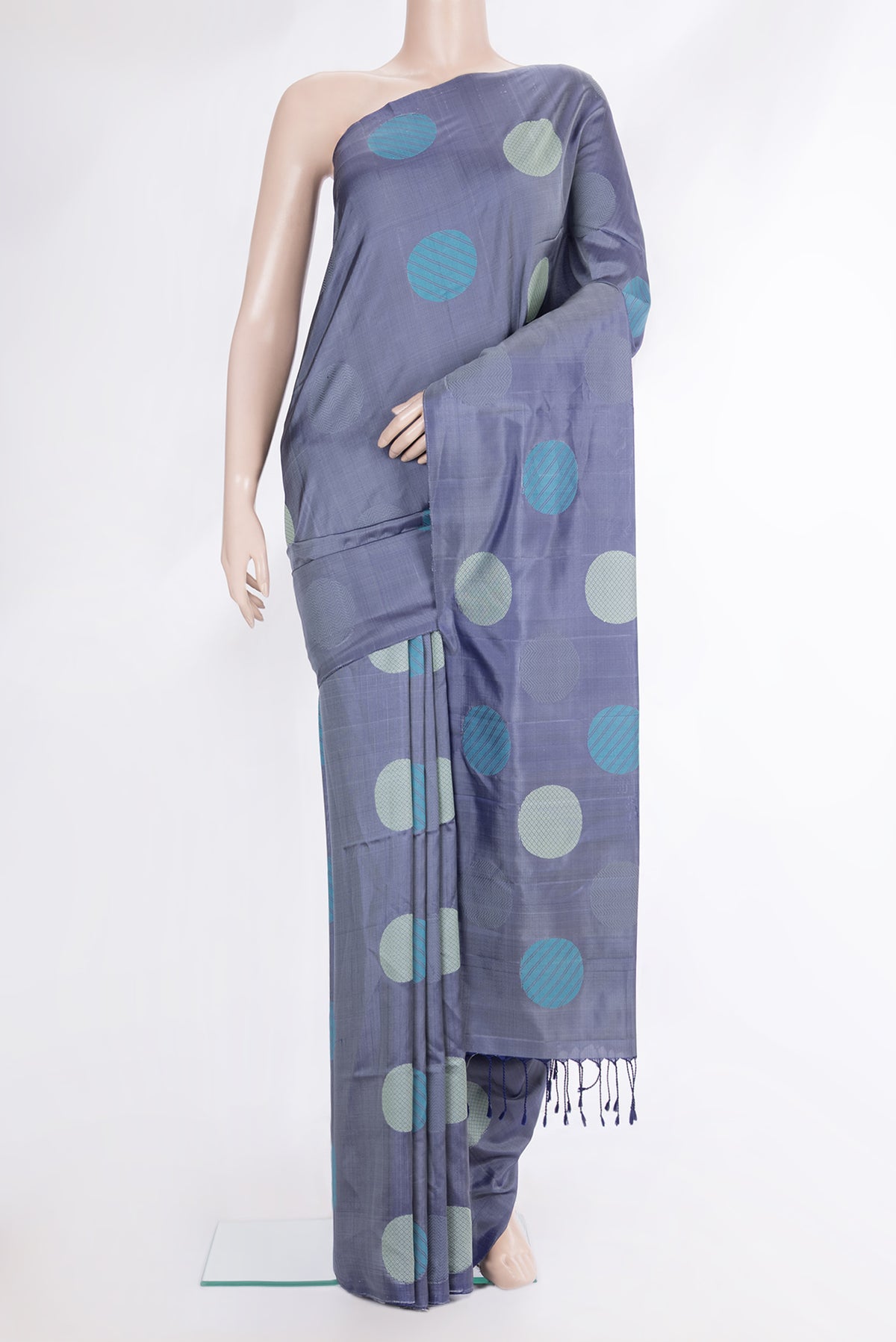 Pure Silk Maya Blue Dual Tone Soft Saree with Thread Butta on the body and Without Border.  displayed on a mannequin