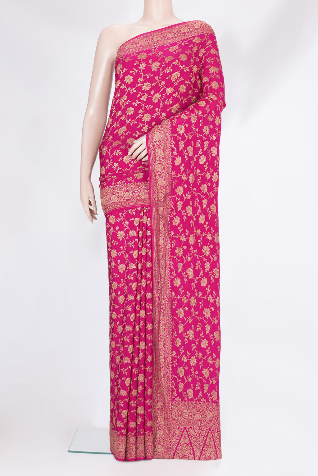 Magenta Banarasi Georgette Saree with Zari Brocade on the body and Zari Border.  displayed on a mannequin