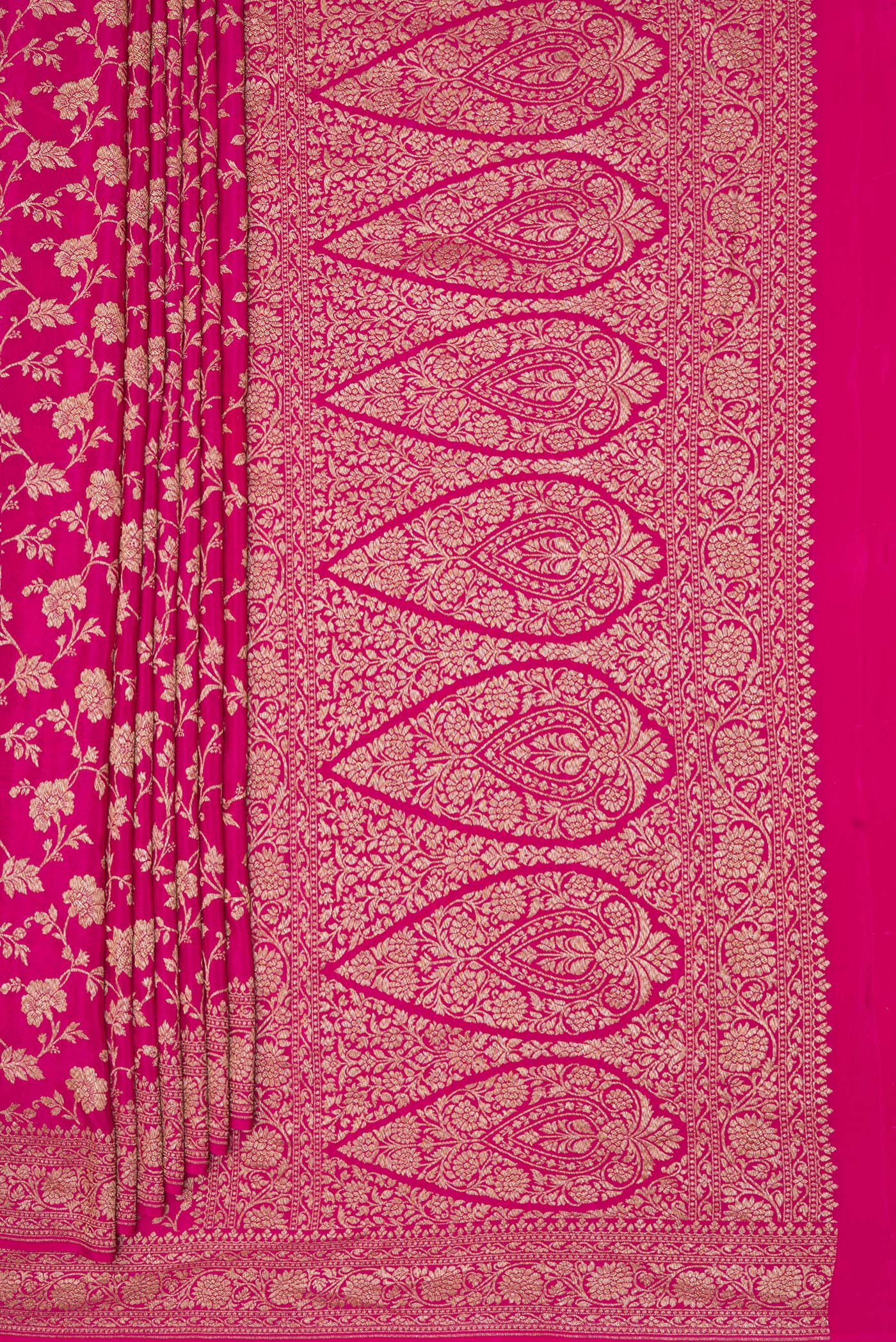 Pleats and pallu of Magenta Banarasi Georgette Saree with Zari Brocade on the body and Zari Border. 