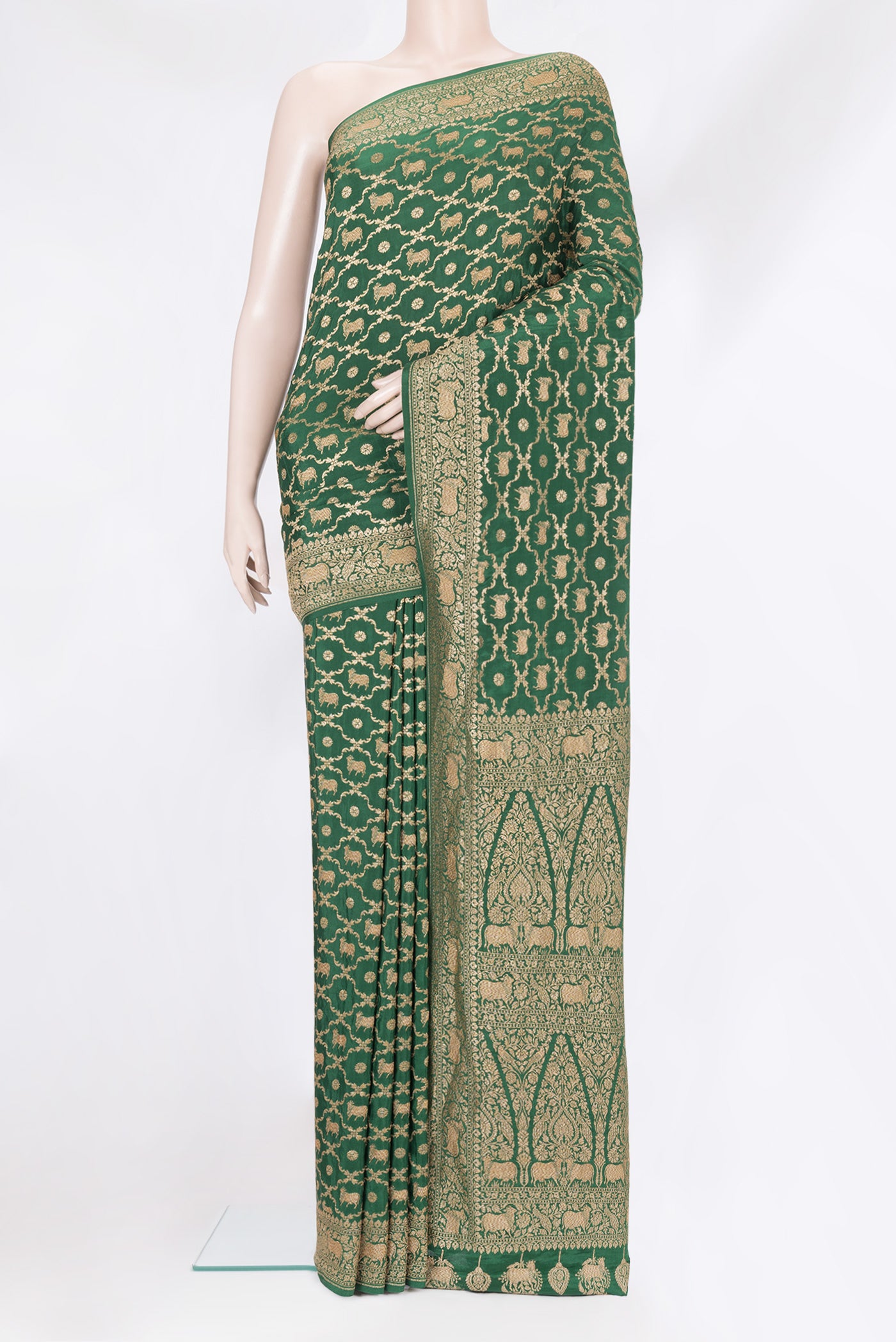 Bottle Green Banarasi Georgette Saree with Zari Brocade on the body and Zari Border.  displayed on a mannequin