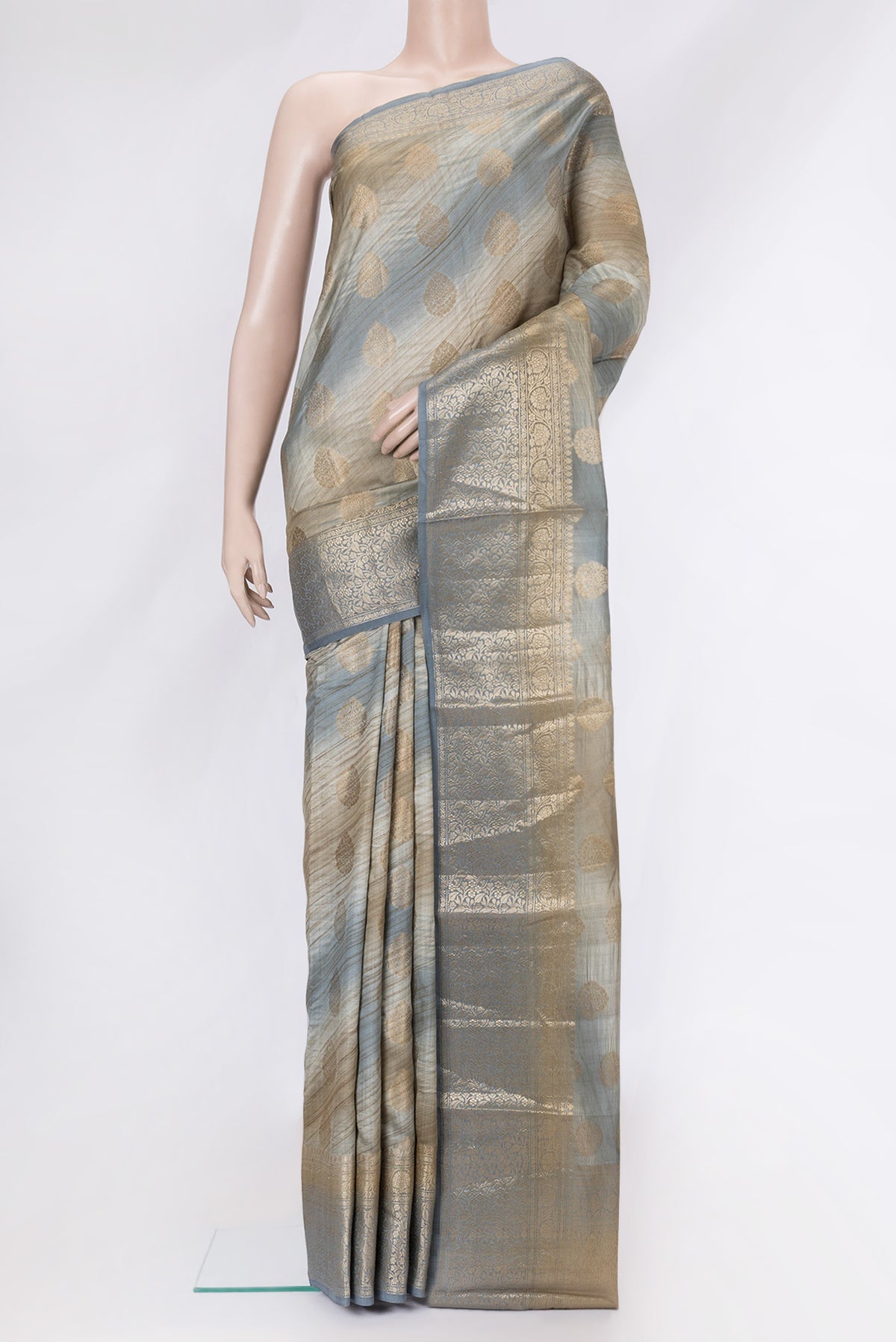 Grey Dual Tone Banarasi Raw Silk Saree with Zari Butta on the body and Zari Border.  displayed on a mannequin