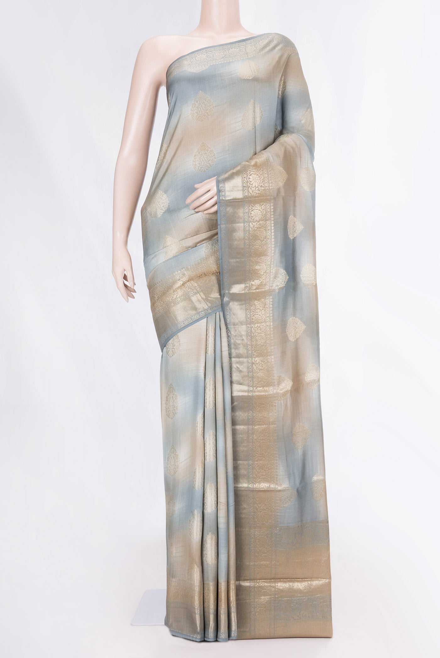 Multi Color Banarasi Raw Silk Saree with Zari Butta on the body and Zari Border displayed on a mannequin