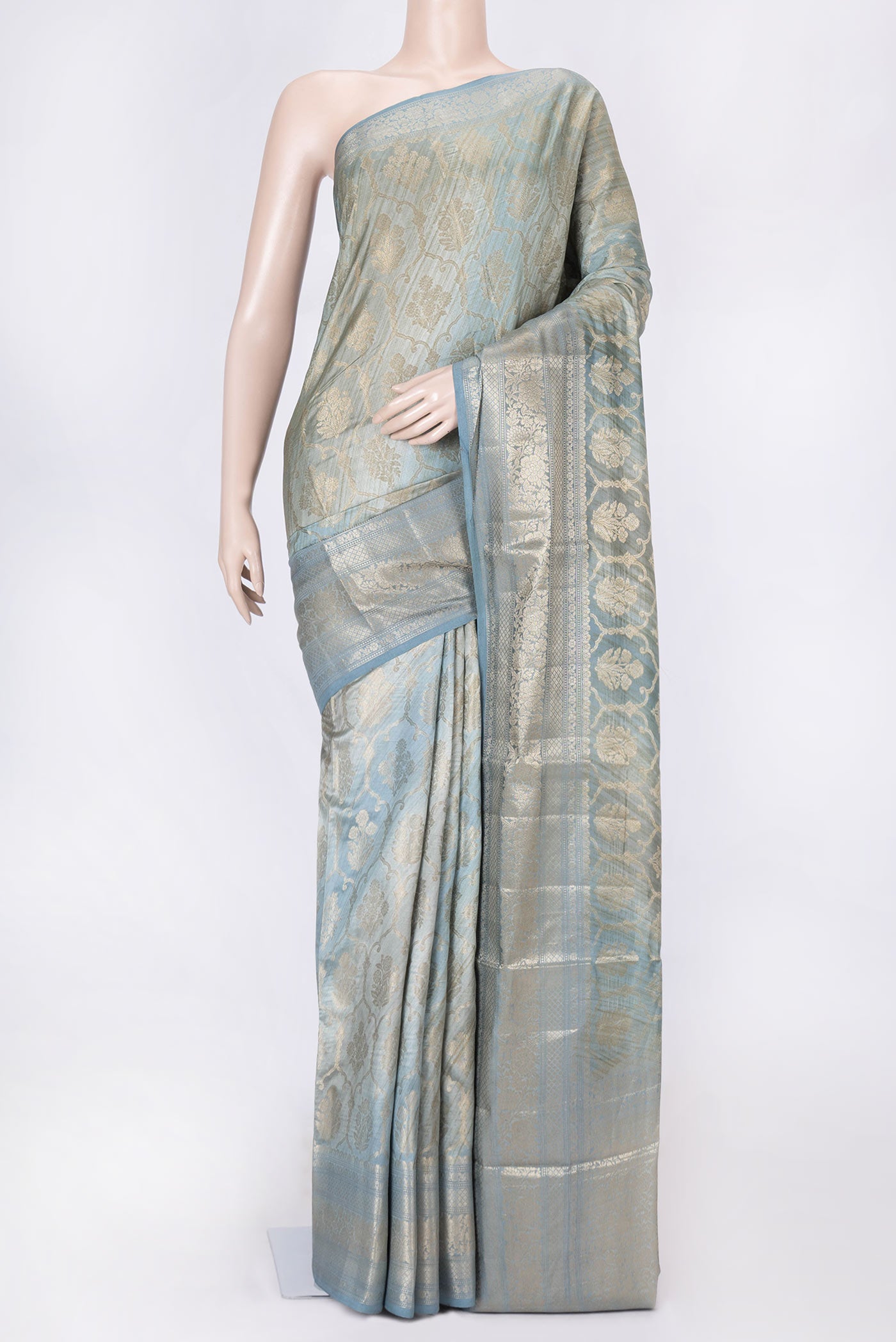 Grey Dual Tone Tussar Silk Saree with Zari Brocade on the body and Zari Border displayed on a mannequin