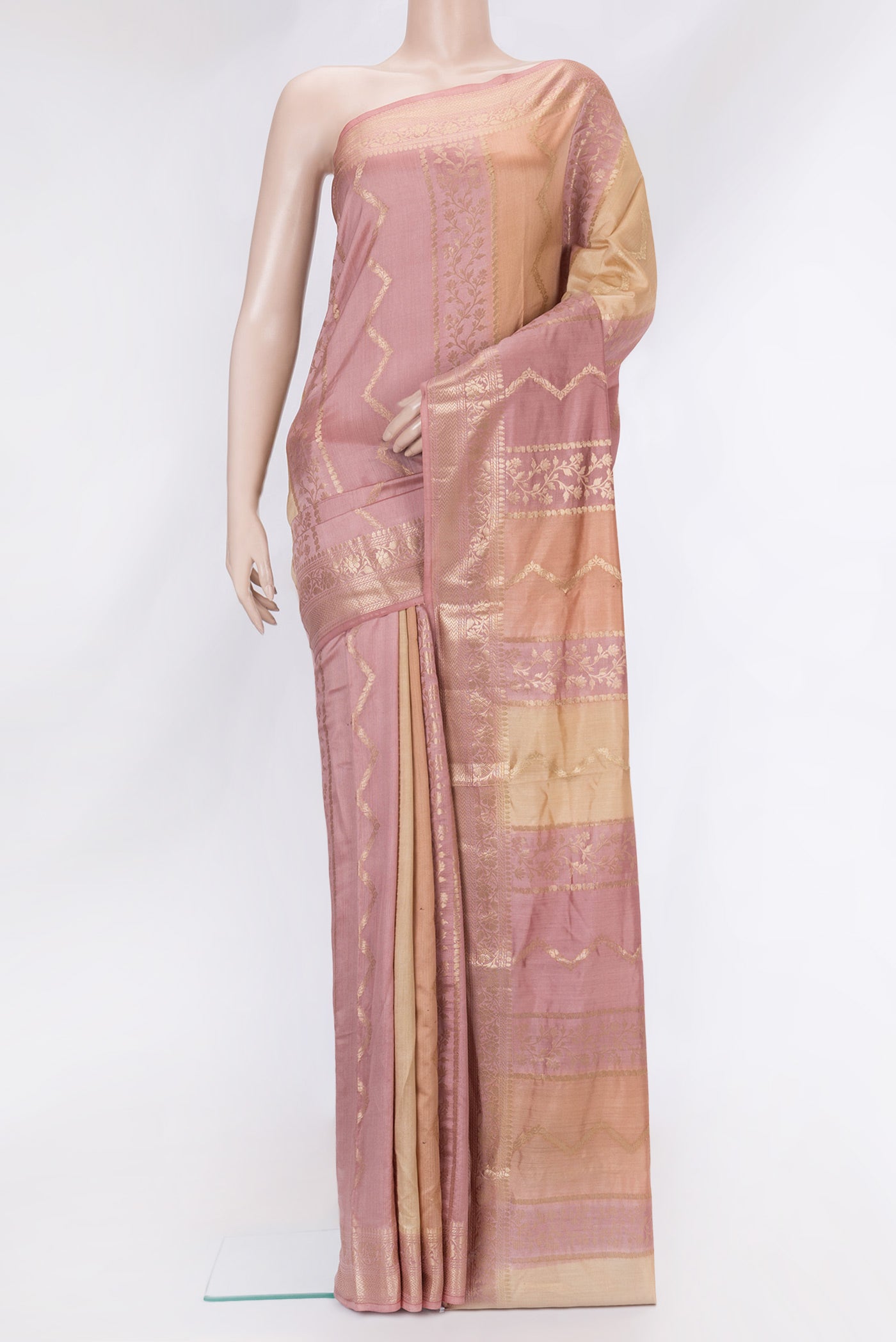 Rose Gold and Peach Color Banarasi Raw Silk Saree with Stripes on the body and Zari Border.  displayed on a mannequin