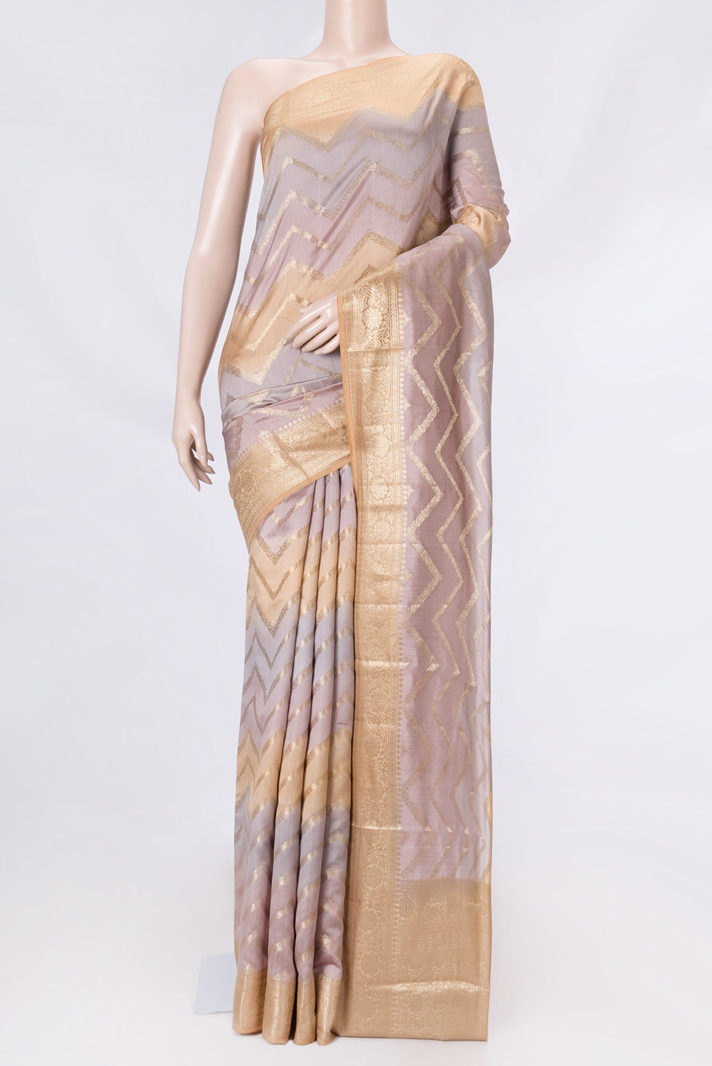 Lavender and Peach Color Banarasi Raw Silk Saree with Zig Zag design on the body and Zari Border displayed on a mannequin