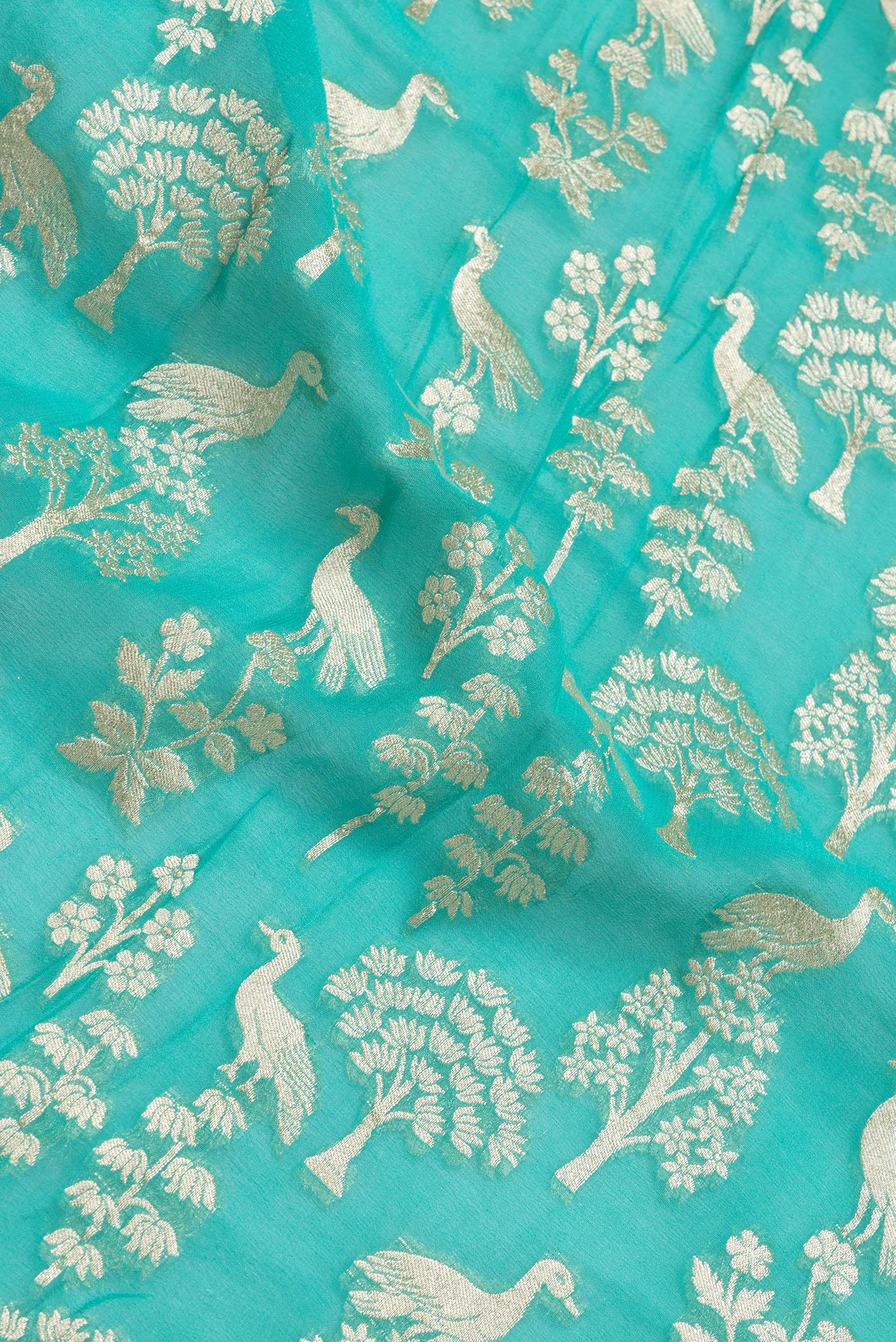 Close up of Sea Green Dual Tone Banarasi Georgette Saree with Zari Brocade on the body and Zari Border.  displaying folds