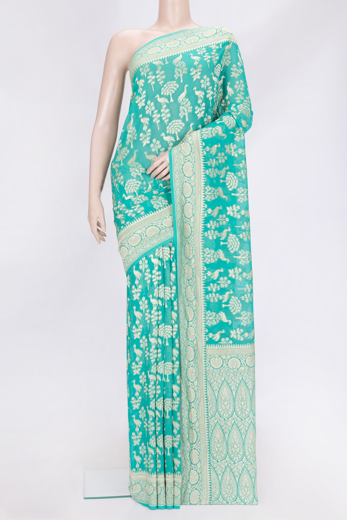Sea Green Dual Tone Banarasi Georgette Saree with Zari Brocade on the body and Zari Border.  displayed on a mannequin