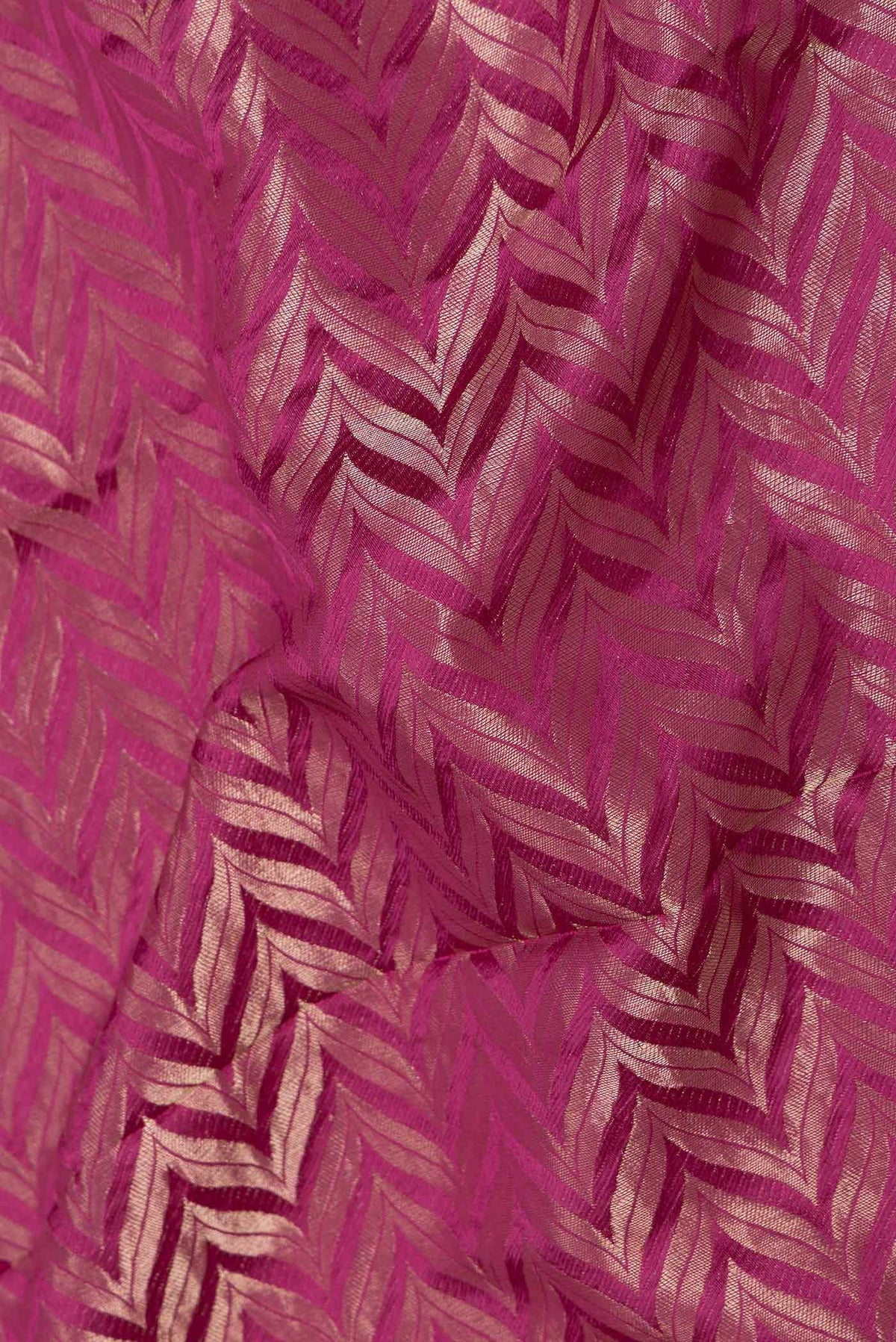 Close up of Light Magenta Mysore Crepe Saree with Zari Brocade on the body and Zari Border displaying folds