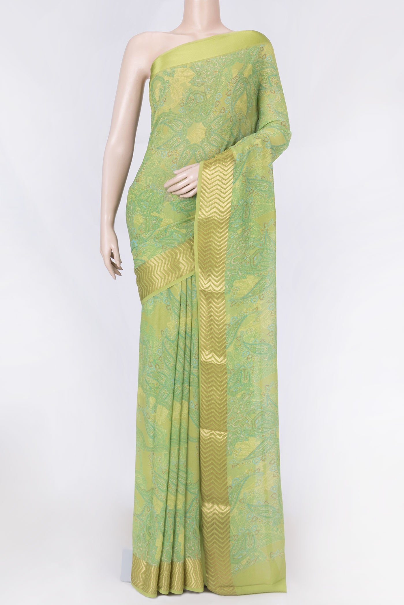 Light Green Mysore Georgette Saree with Printed design on the body and Zari Border displayed on a mannequin