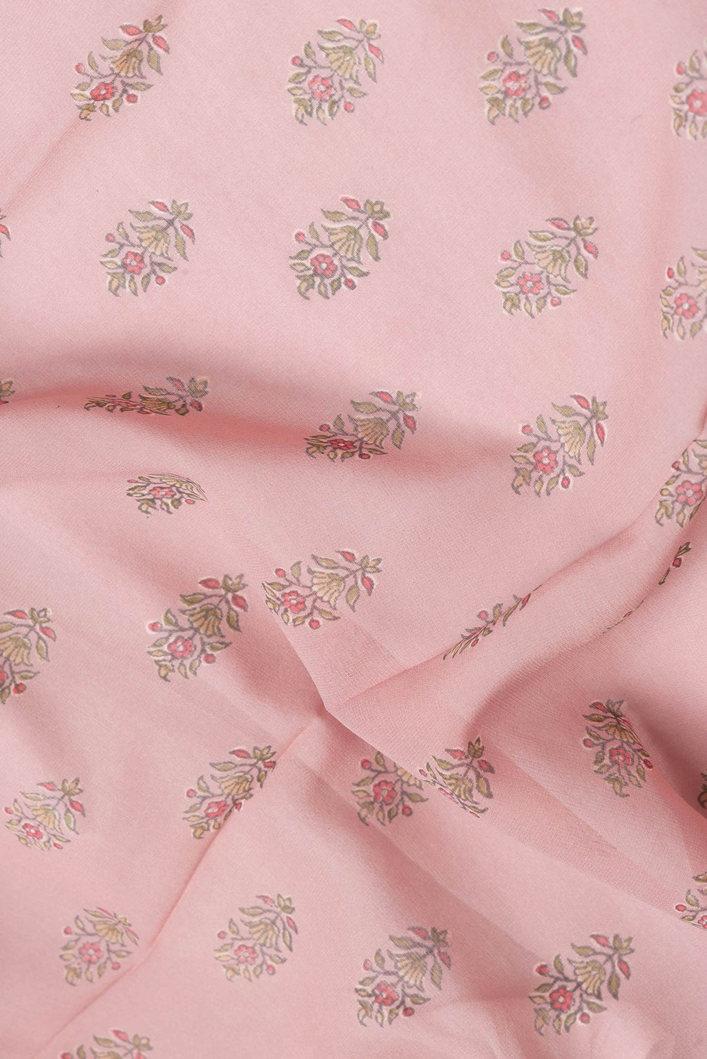 Close up of Rose Gold Dual Tone Mysore Crepe Saree with Printed design on the body and Zari Border.  displaying folds