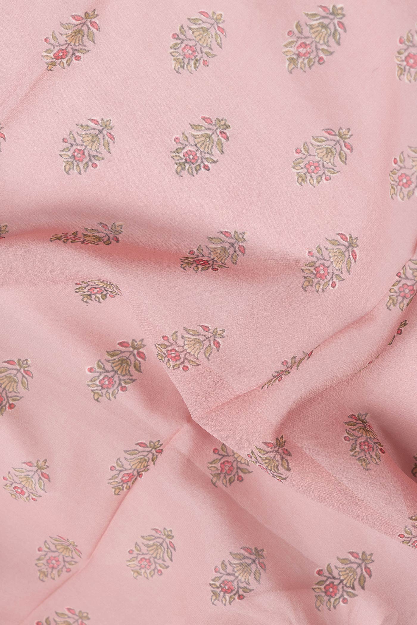 Close up of Rose Gold Dual Tone Mysore Crepe Saree with Printed design on the body and Zari Border.  displaying folds