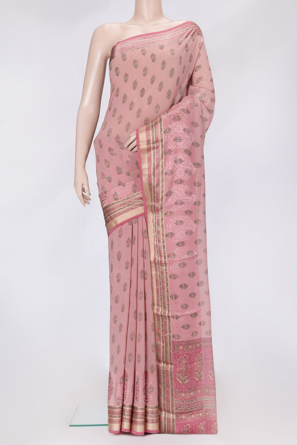 Rose Gold Dual Tone Mysore Crepe Saree with Printed design on the body and Zari Border.  displayed on a mannequin