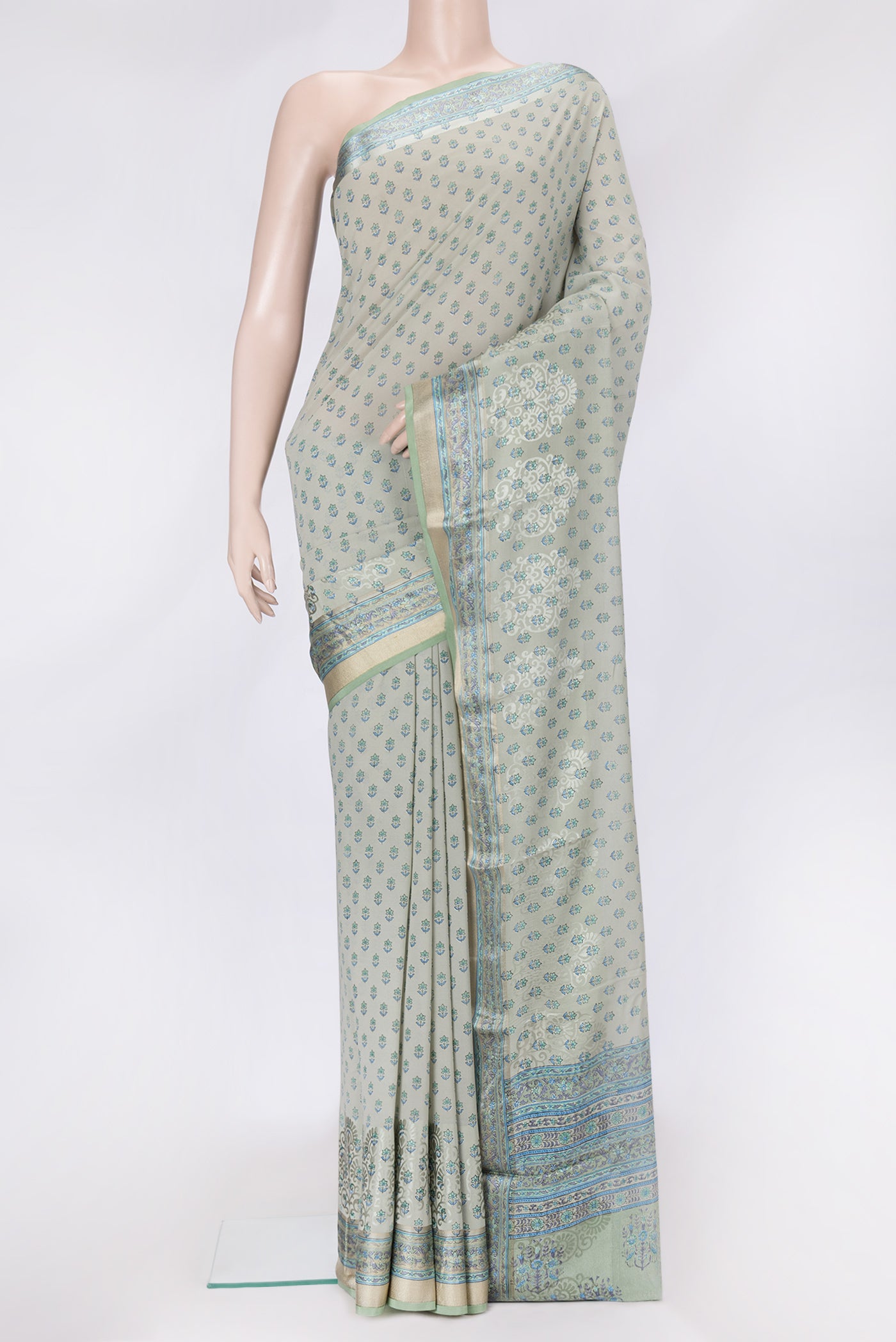 Grey Dual Tone Mysore Georgette Saree with Printed design on the body and Zari Border.  displayed on a mannequin