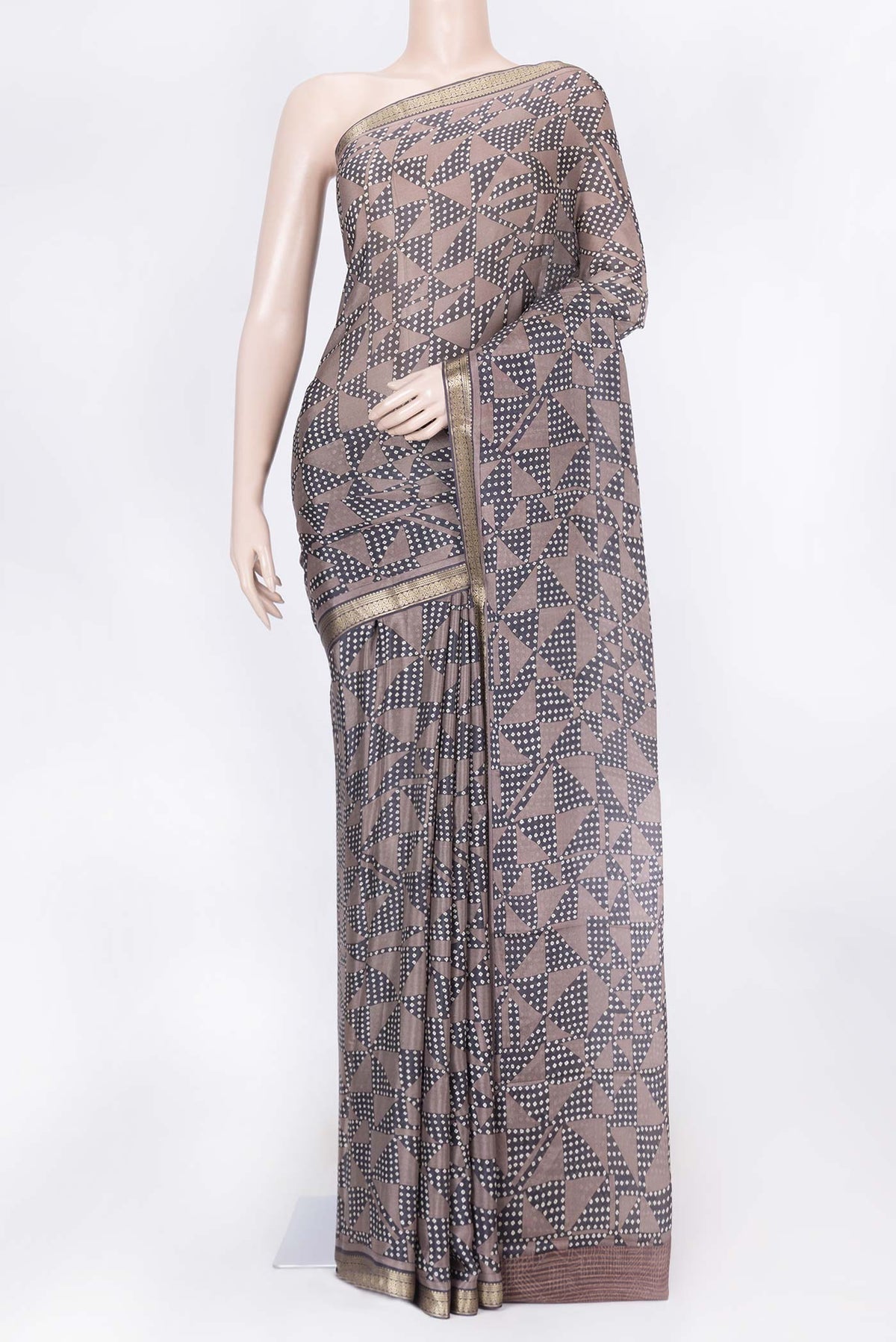 Brown Dual Tone Tussar Silk Saree with Printed design on the body and Zari Border displayed on a mannequin