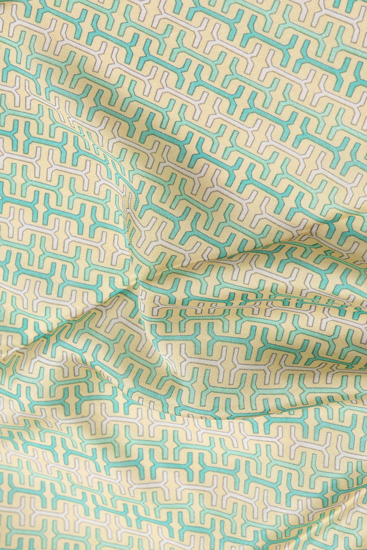 Close up of Sandal Dual Tone Mysore Crepe Saree with Printed design on the body and Zari Border.  displaying folds