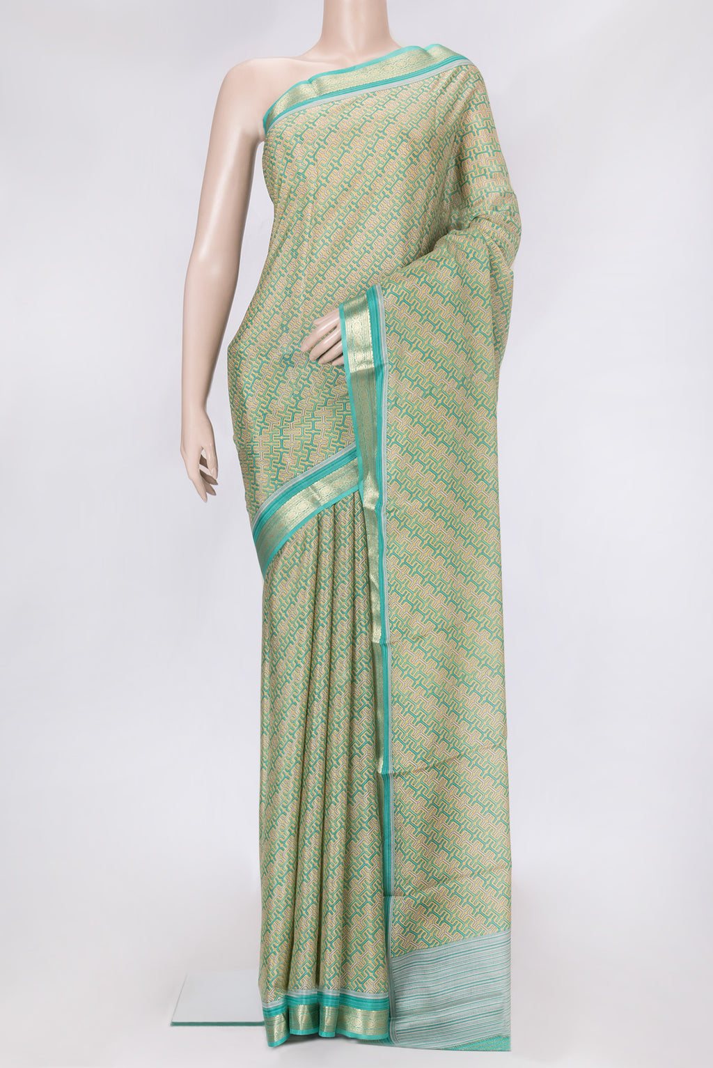 Sandal Dual Tone Mysore Crepe Saree with Printed design on the body and Zari Border.  displayed on a mannequin