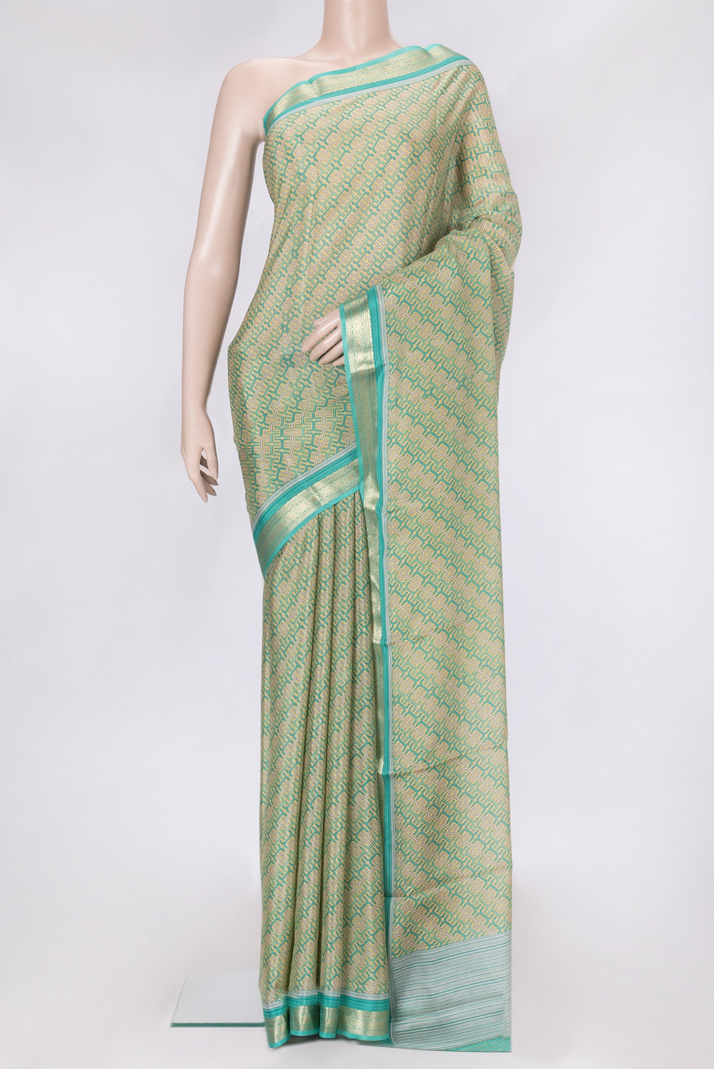 Sandal Dual Tone Mysore Crepe Saree with Printed design on the body and Zari Border.  displayed on a mannequin