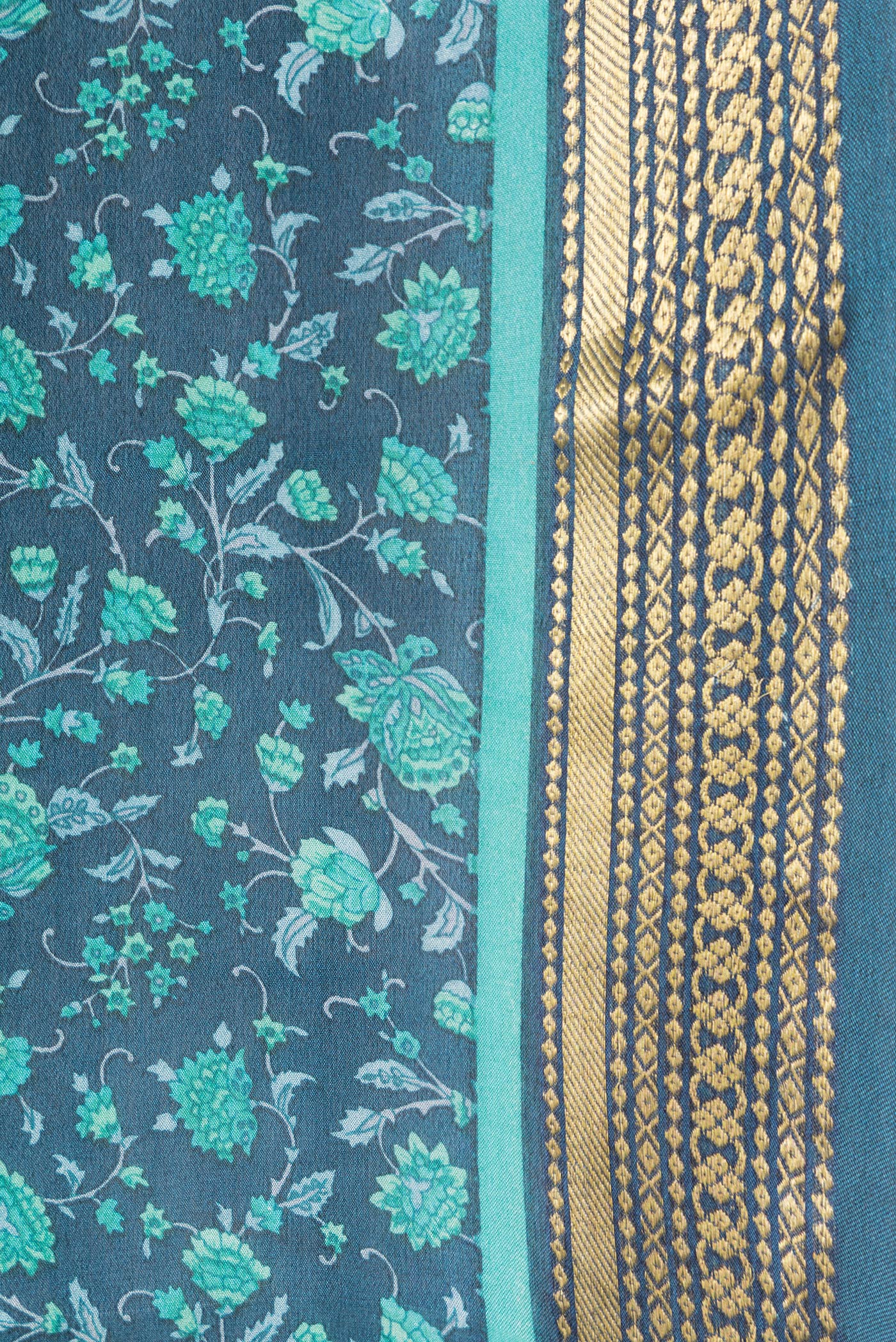 Border image of Peacock Blue Dual Tone Mysore Crepe Saree with Printed design on the body and Zari Border. 