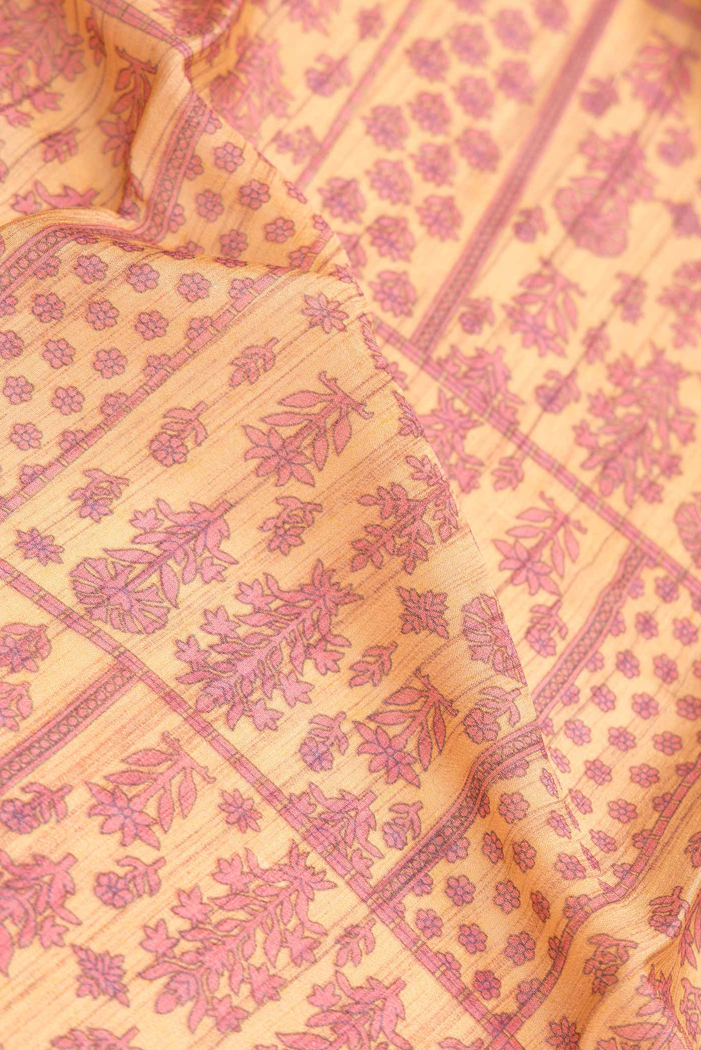 Close up of Sandal Dual Tone Mysore Crepe Saree with Printed design on the body and Zari Border.  displaying folds