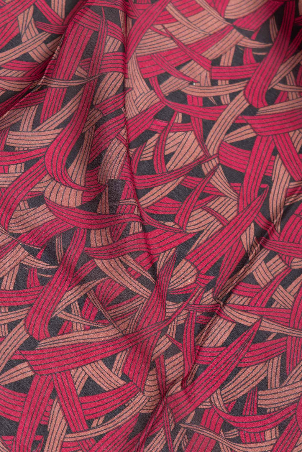 Close up of Black Dual Tone Mysore Crepe Saree with Printed design on the body and Zari Border.  displaying folds
