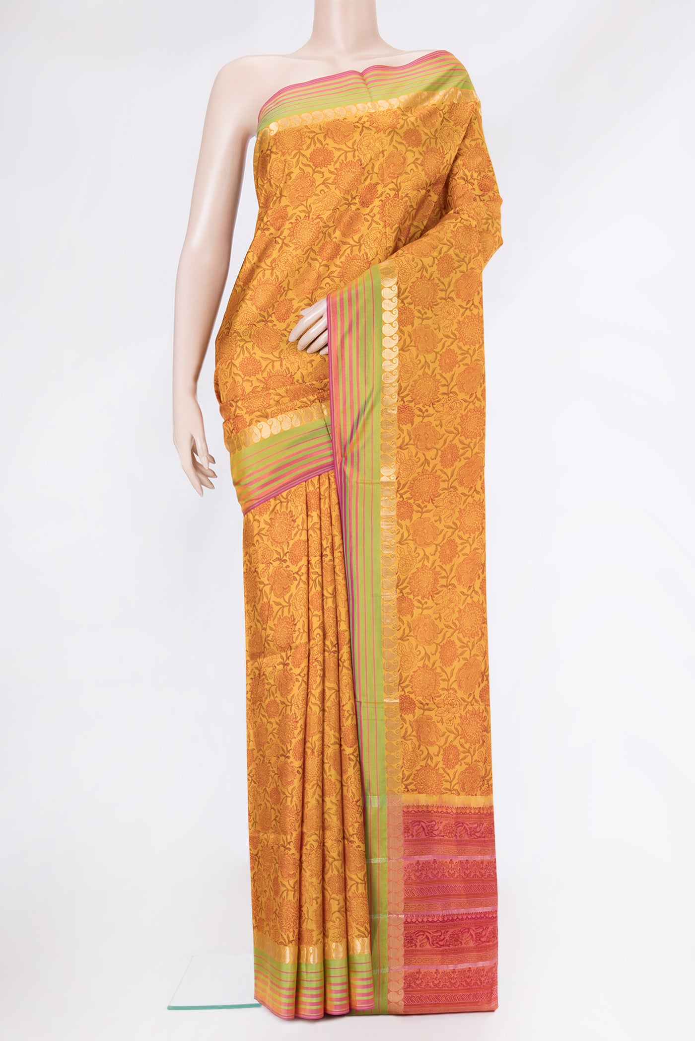 Mustard Dual Tone Kanchipuram Silk Saree with Printed design on the body and Zari Border.  displayed on a mannequin