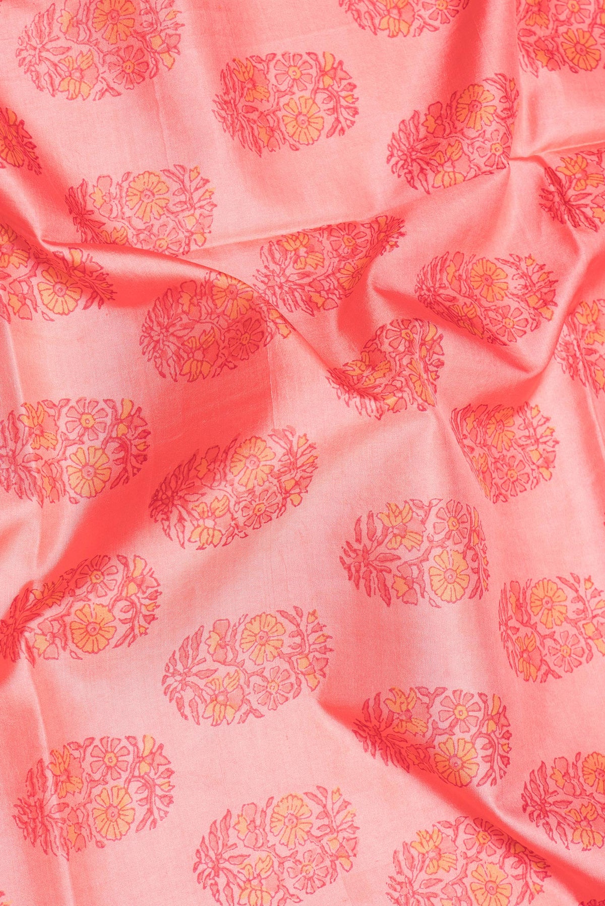Close up of Pure Silk Rose pink Dual Tone Kanchipuram Saree with Printed design on the body and Zari Border.  displaying folds
