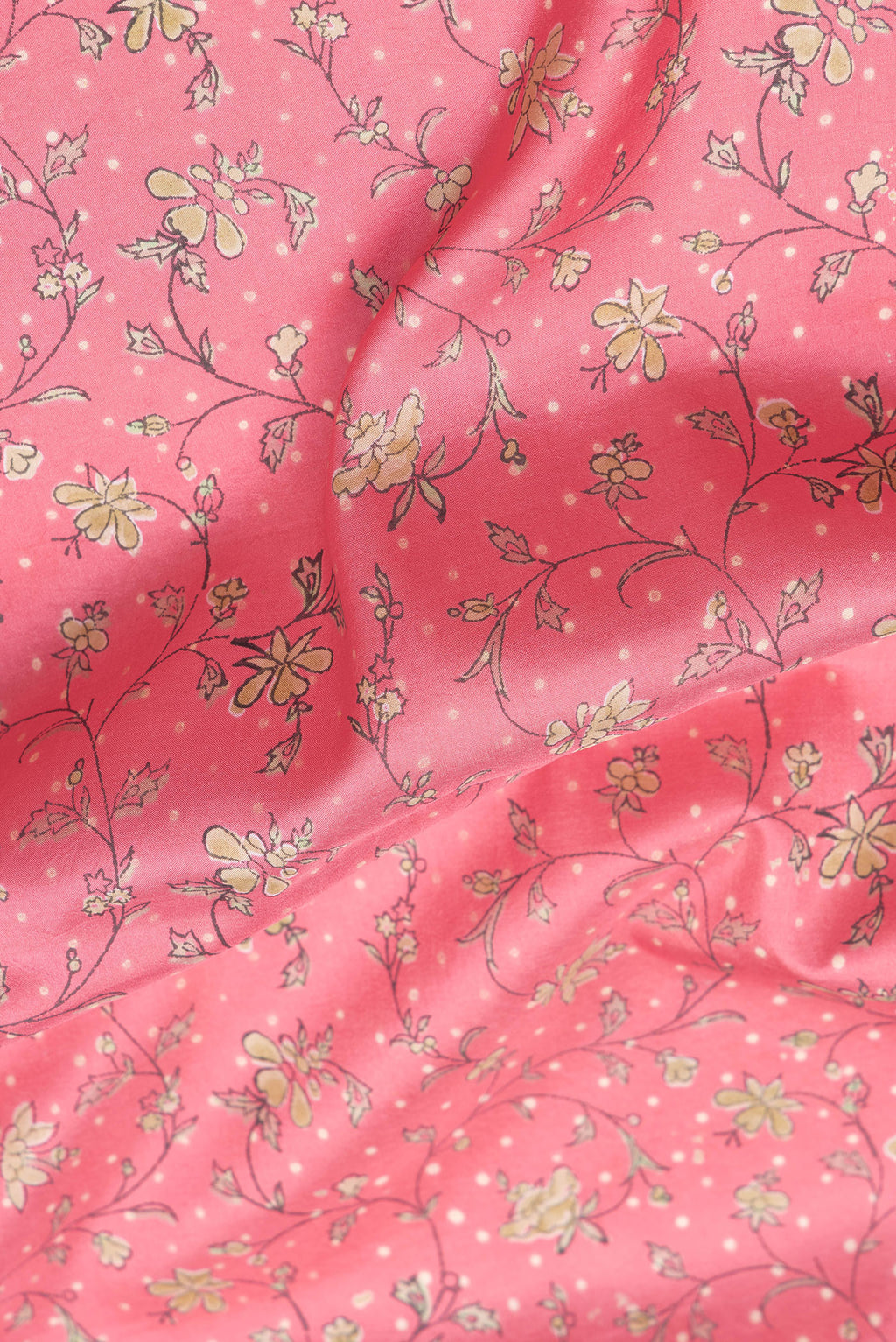 Close up of Pink Dual Tone Kanchipuram Silk Saree with Printed design on the body and Zari Border.  displaying folds