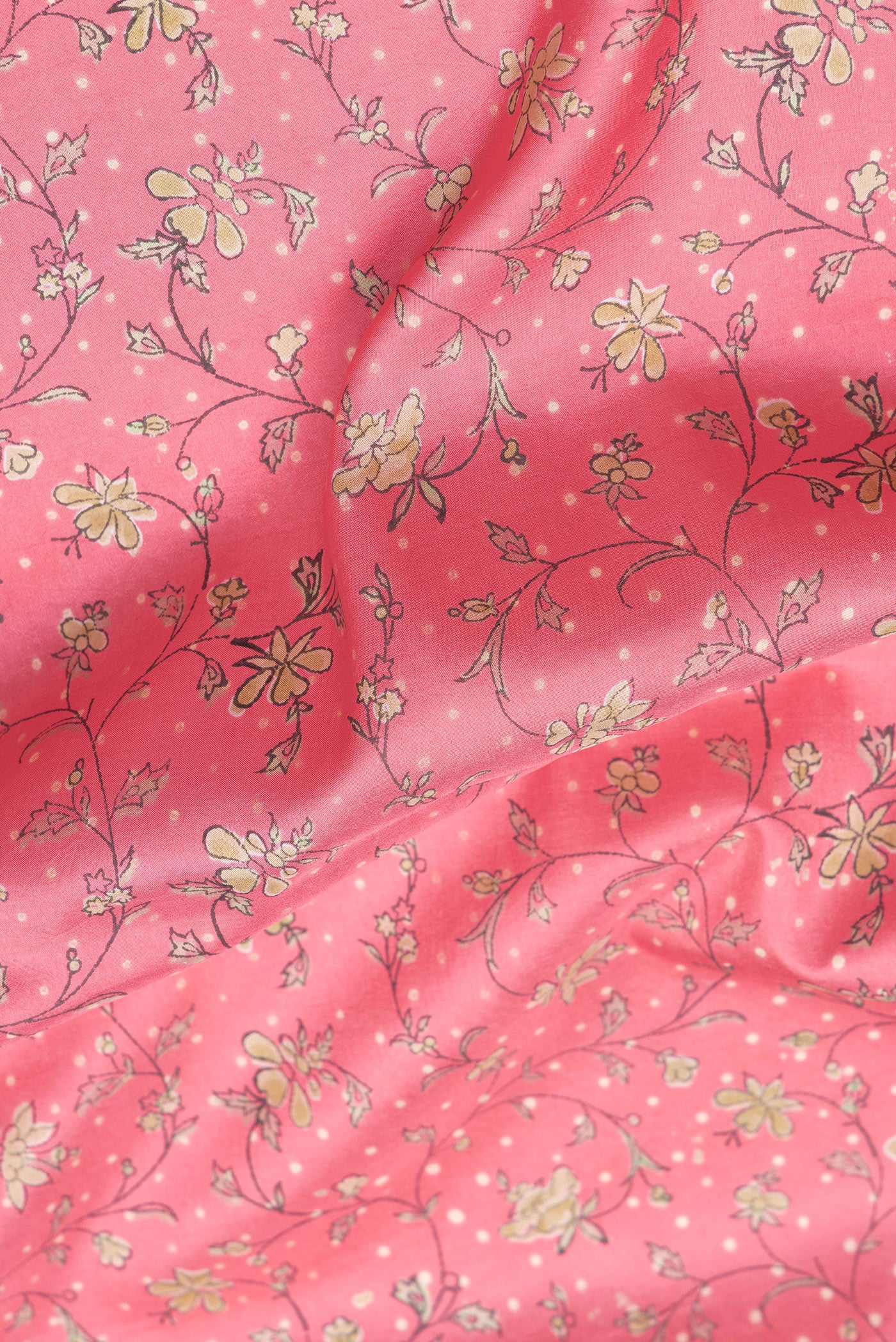 Close up of Pink Dual Tone Kanchipuram Silk Saree with Printed design on the body and Zari Border.  displaying folds