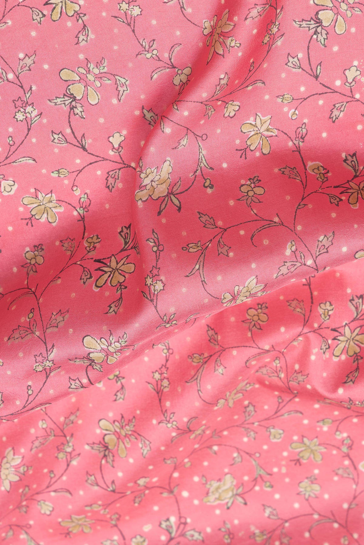 Close up of Pink Dual Tone Kanchipuram Silk Saree with Printed design on the body and Zari Border.  displaying folds
