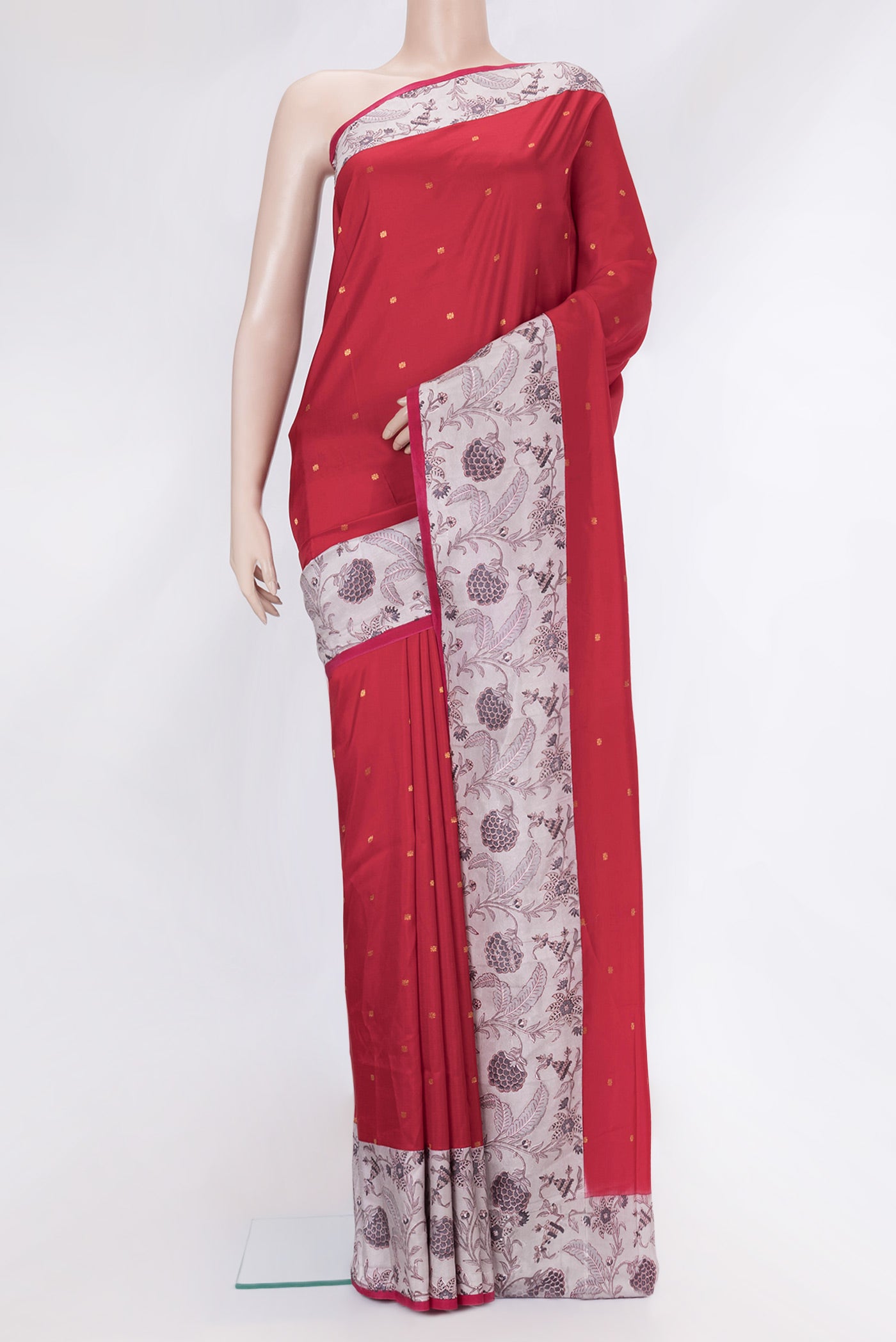 Red Kanchipuram Silk Saree with Zari Butta on the body and Printed Border.  displayed on a mannequin