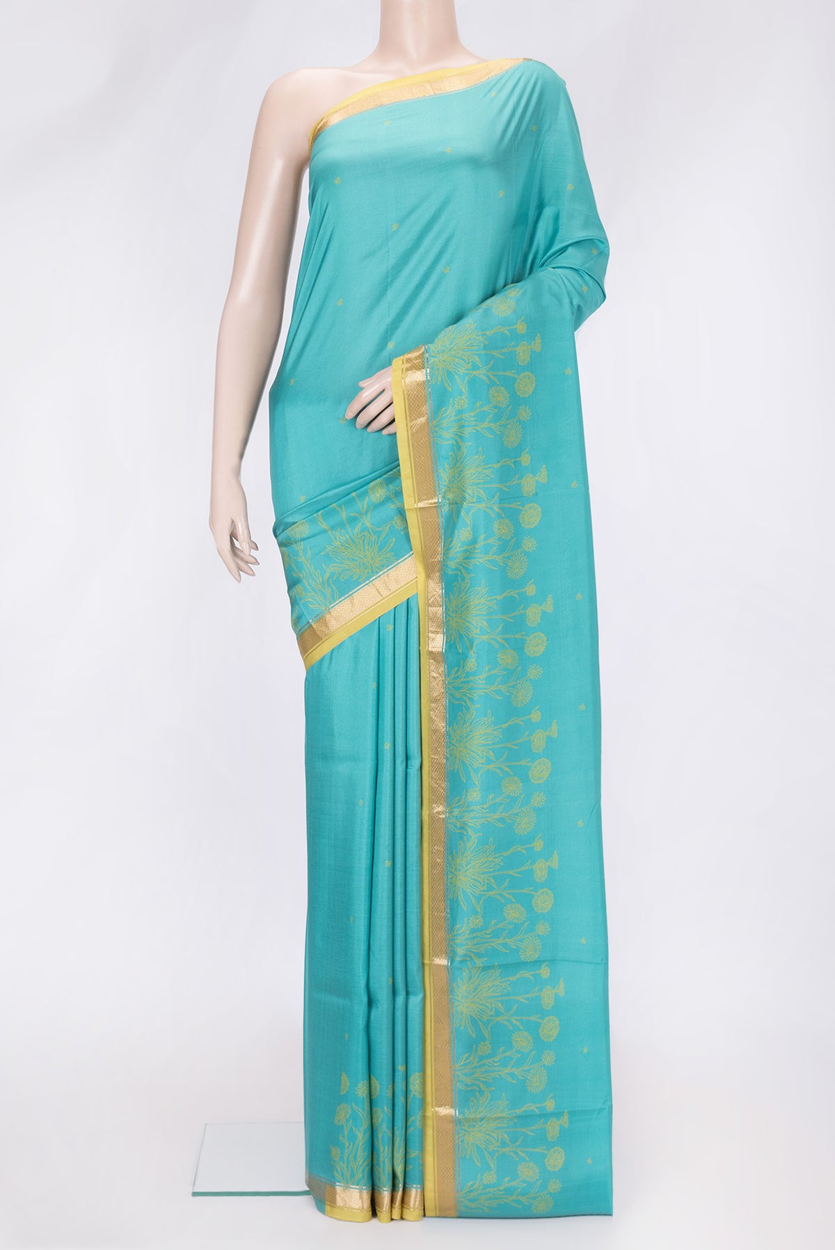 Sky Blue Dual Tone Printed Silk Saree with Printed design on the body and Fancy Border.  displayed on a mannequin