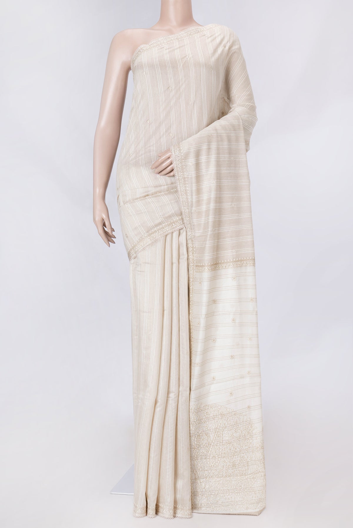 Beige Dual Tone Tussar Saree with Embroidery on the body and Embroidery Border displayed on a mannequin