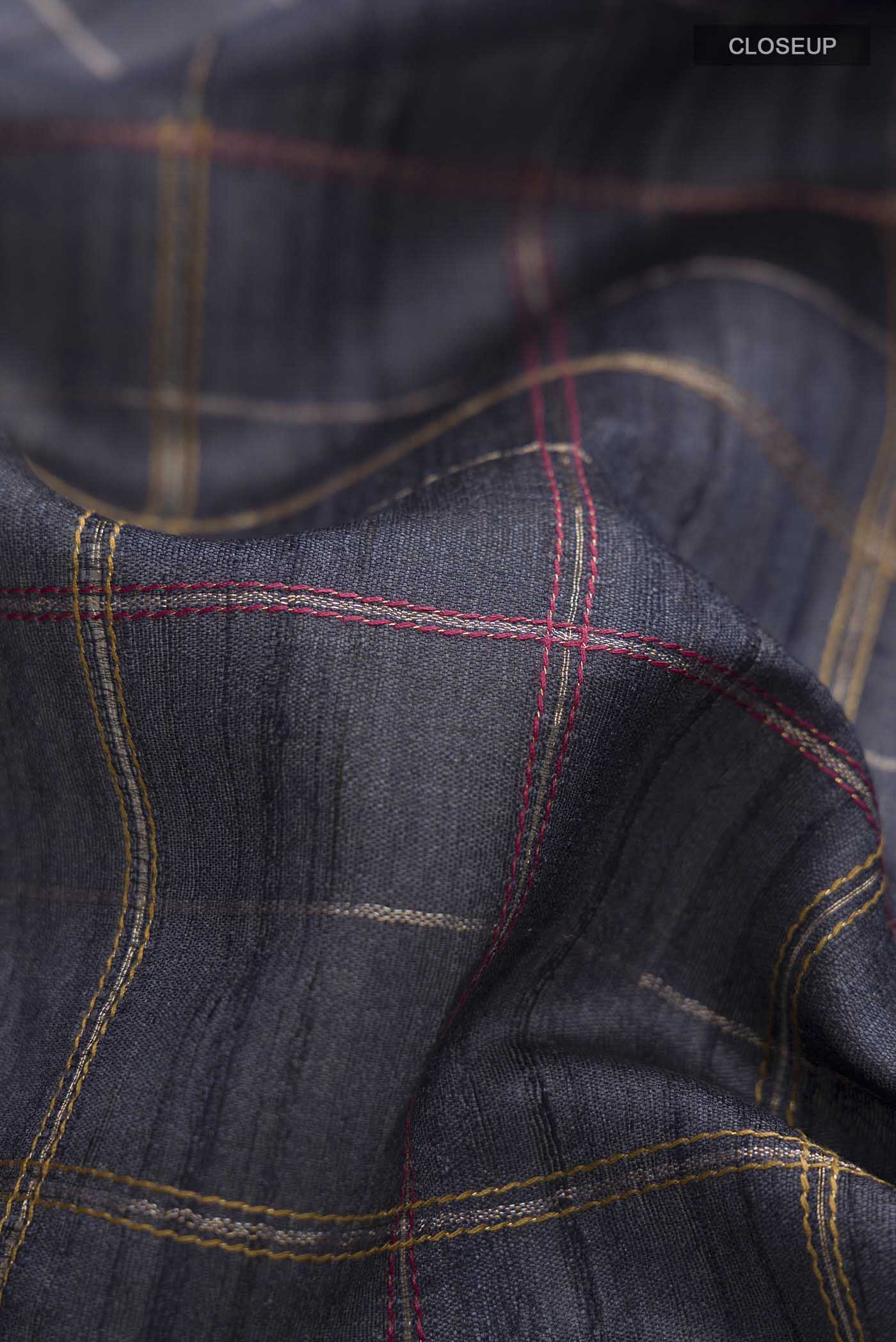 Close up of Blue Bhagalpuri Tussar Silk Saree with Checked design on the body and Embroidery Border displaying folds