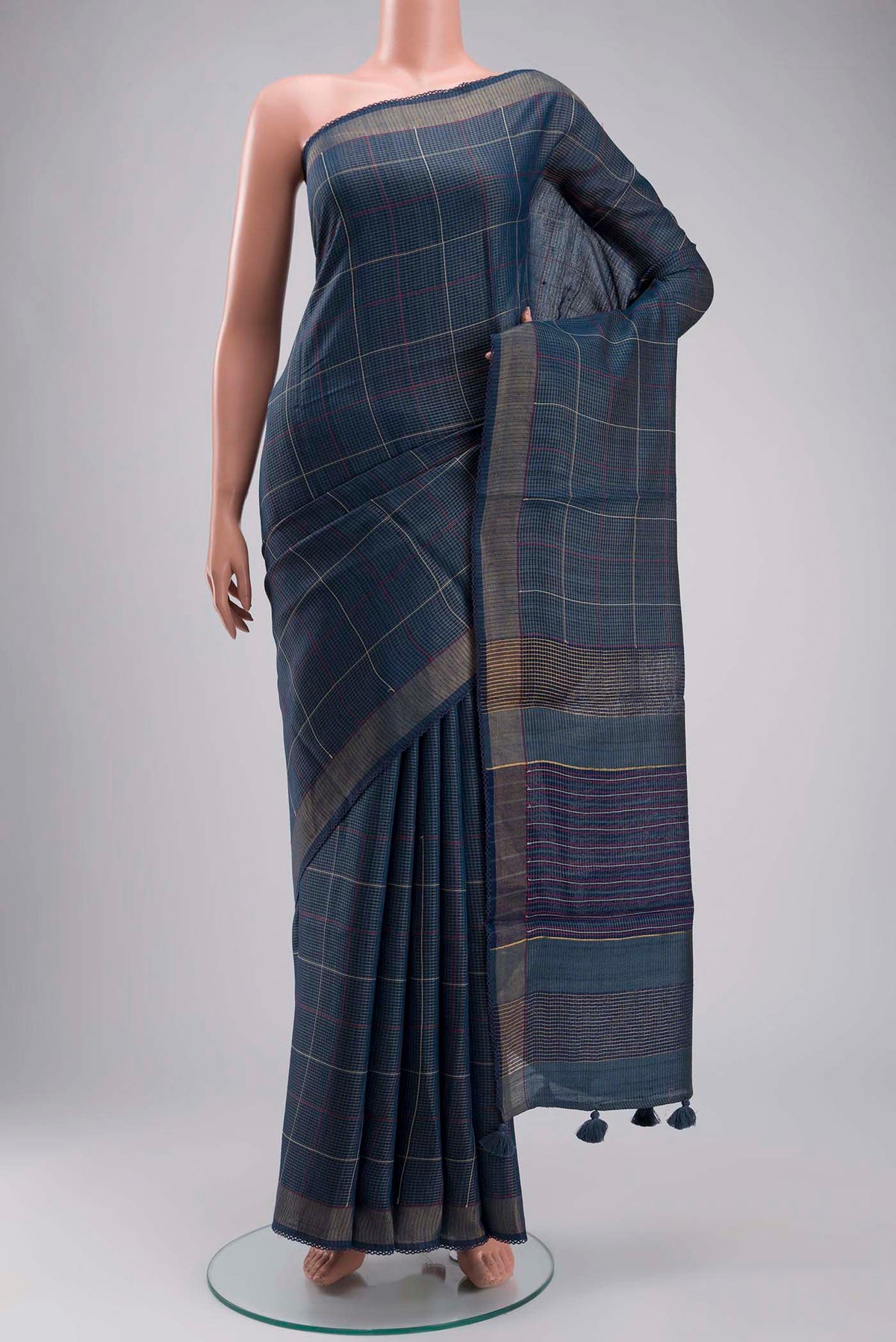 Blue Bhagalpuri Tussar Silk Saree with Stripes on the body and Zari Border displayed on a mannequin