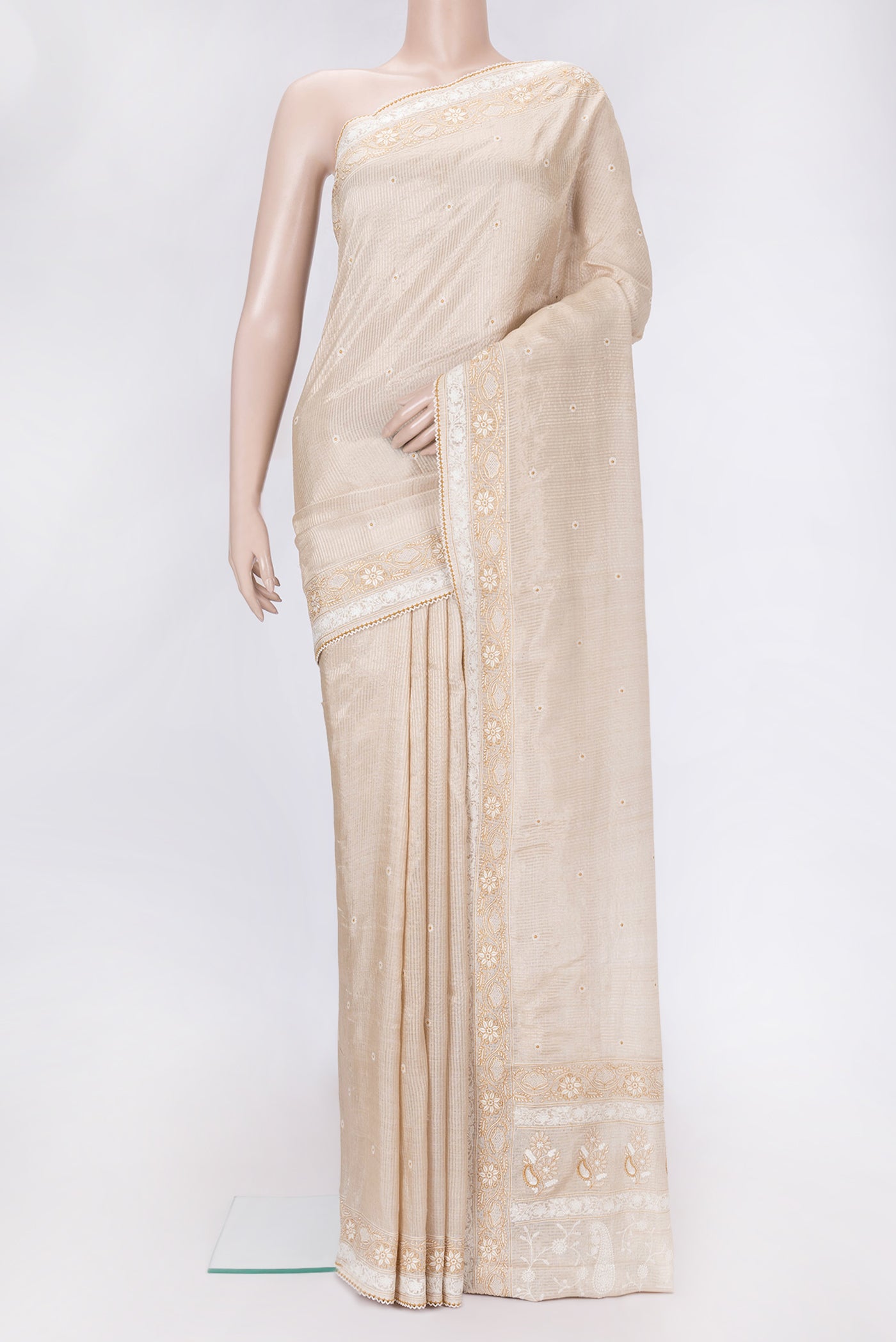 Beige Dual Tone Tussar Silk Saree with Embroidery on the body and Embroidery Border.  displayed on a mannequin