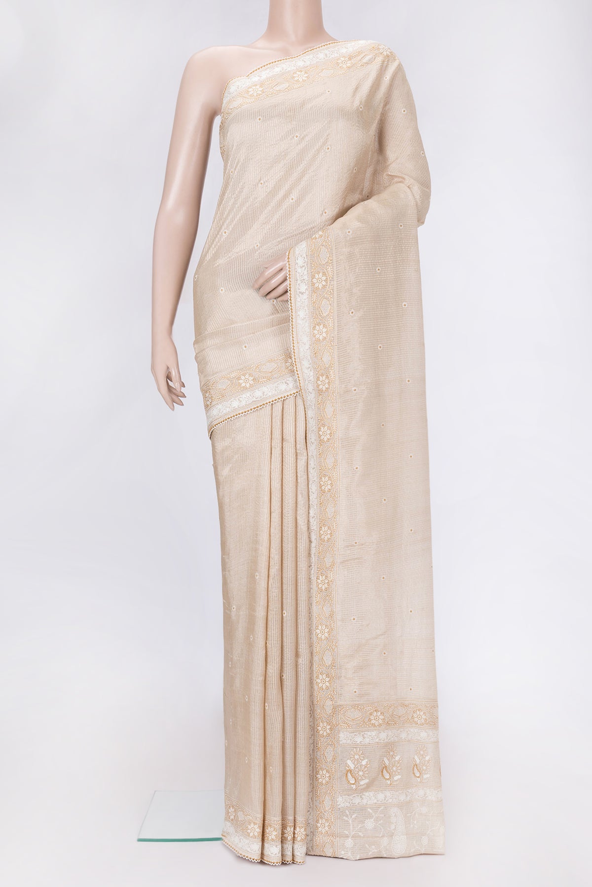 Beige Dual Tone Tussar Silk Saree with Embroidery on the body and Embroidery Border.  displayed on a mannequin