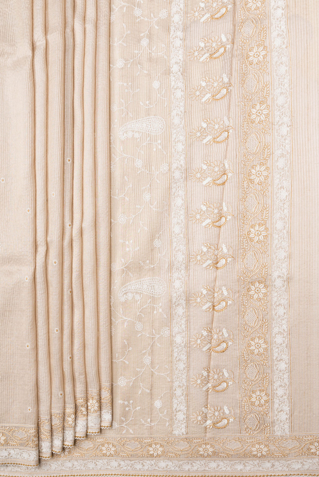 Pleats and pallu of Beige Dual Tone Tussar Silk Saree with Embroidery on the body and Embroidery Border. 
