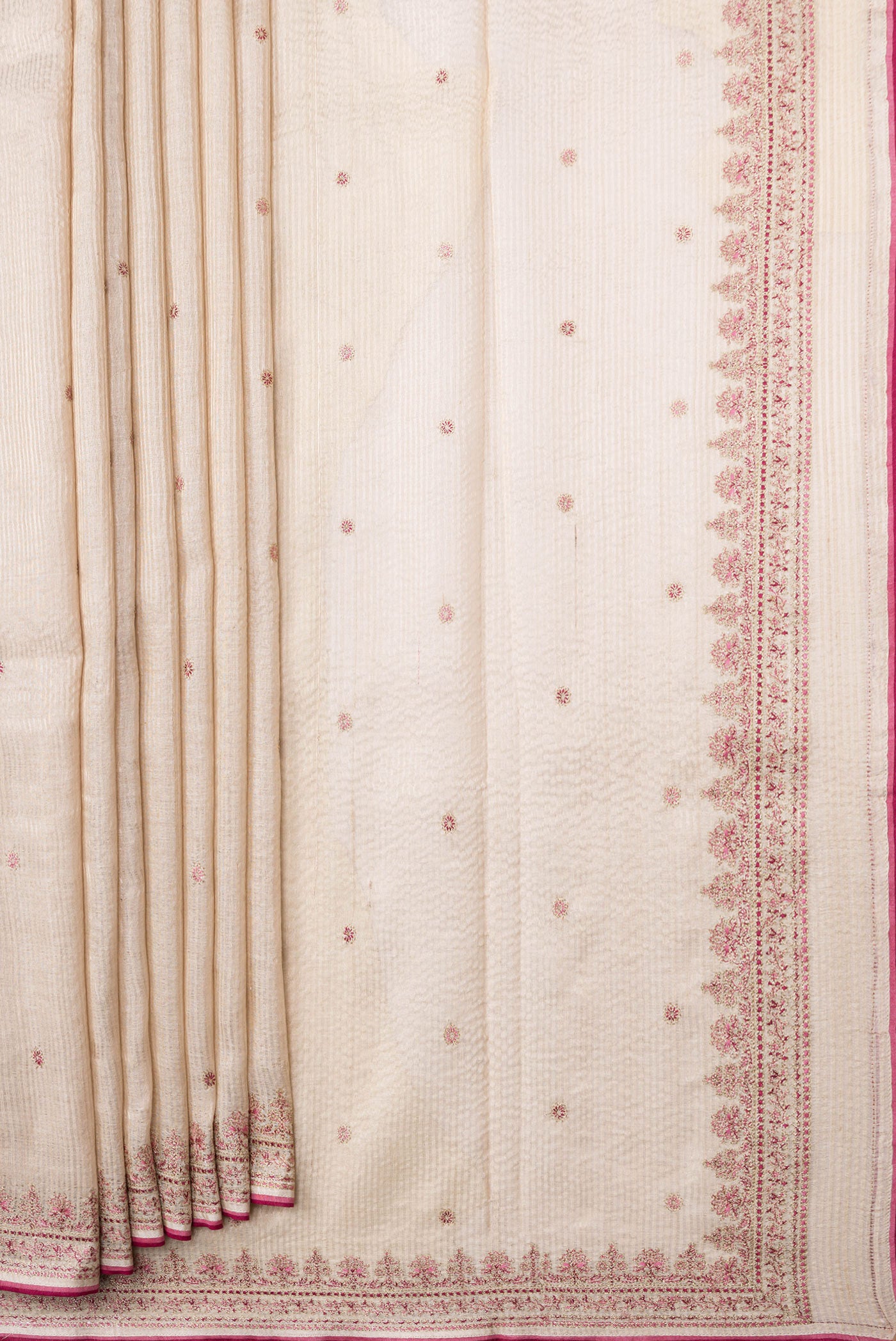 Pleats and pallu of Beige Dual Tone Tussar Silk Saree with Embroidery on the body and Embroidery Border. 