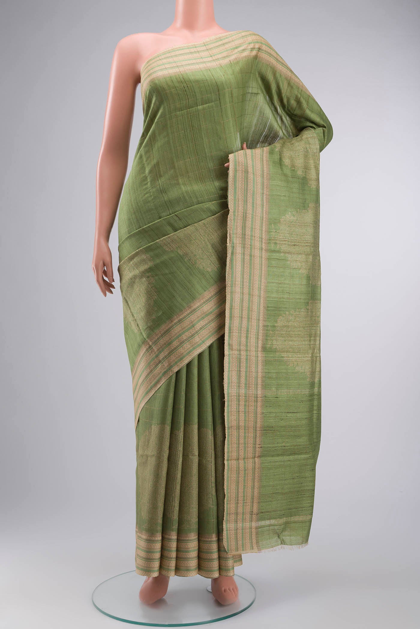 Green Bhagalpuri Tussar Silk Saree with Printed design on the body and Printed Border displayed on a mannequin