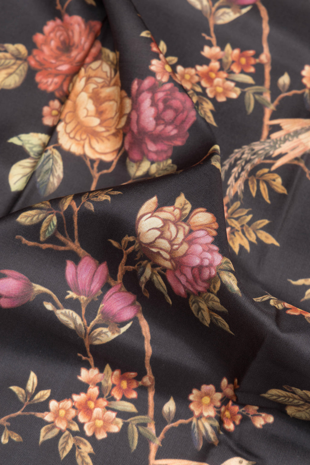 Close up of Pure Silk Black Dual Tone Kanchipuram Saree with Printed design on the body and Zari Border.  displaying folds