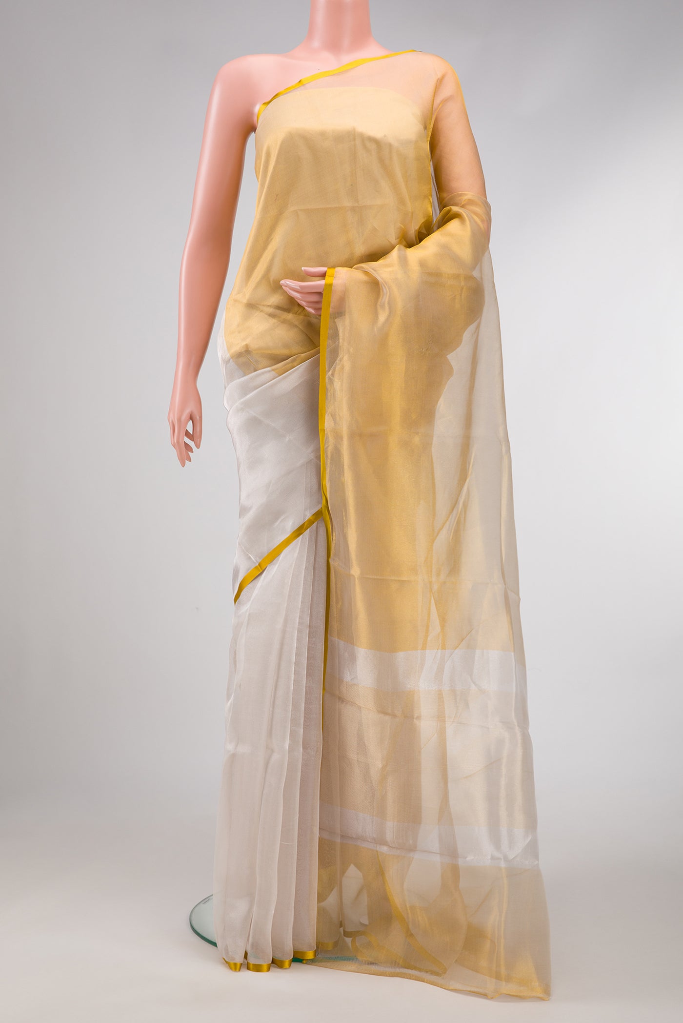 Silver and Gold Color Organza Silk Saree with Plain Body and Plain Border.  displayed on a mannequin