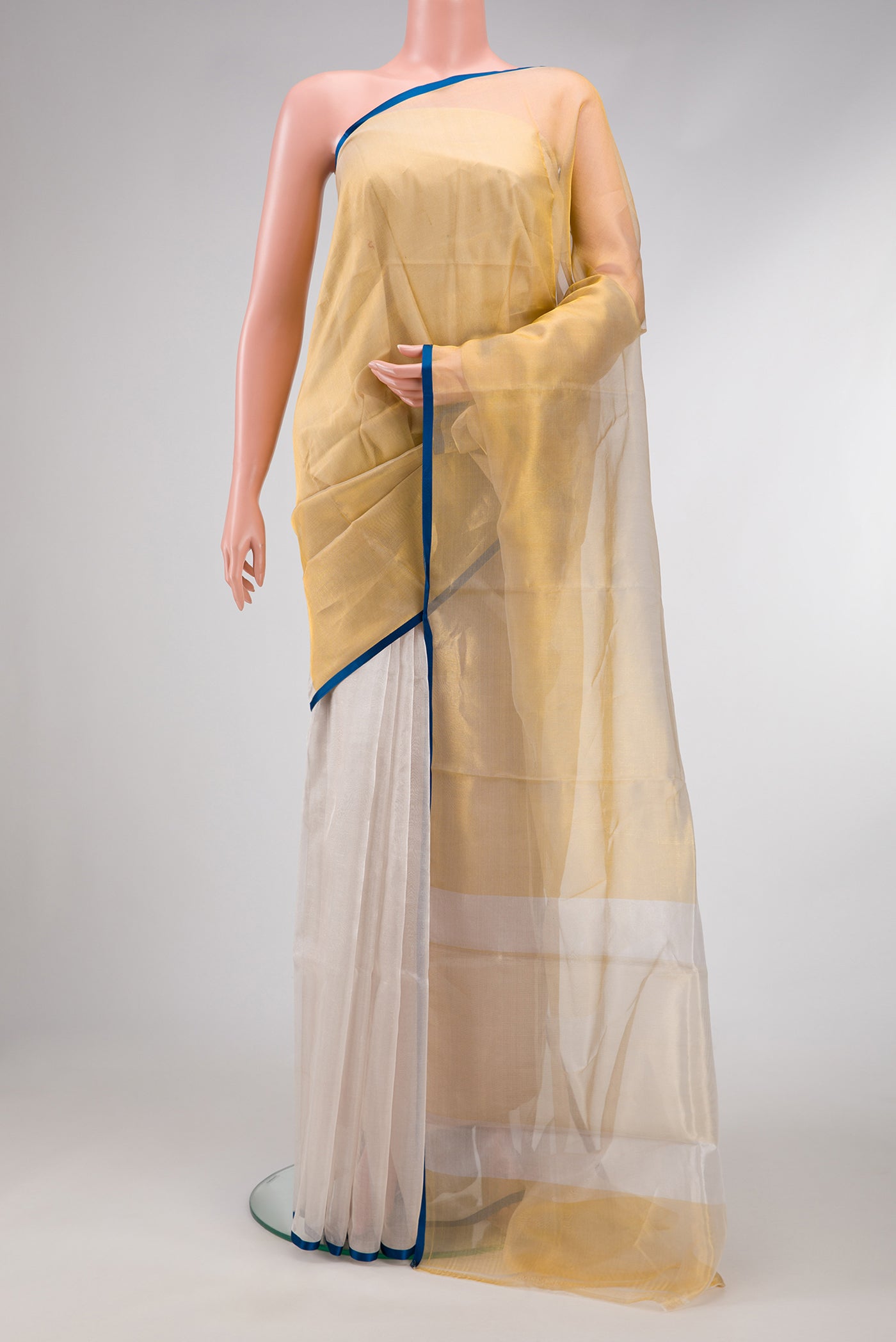 Silver and Gold Color Organza Silk Saree with Plain Body and Plain Border.  displayed on a mannequin