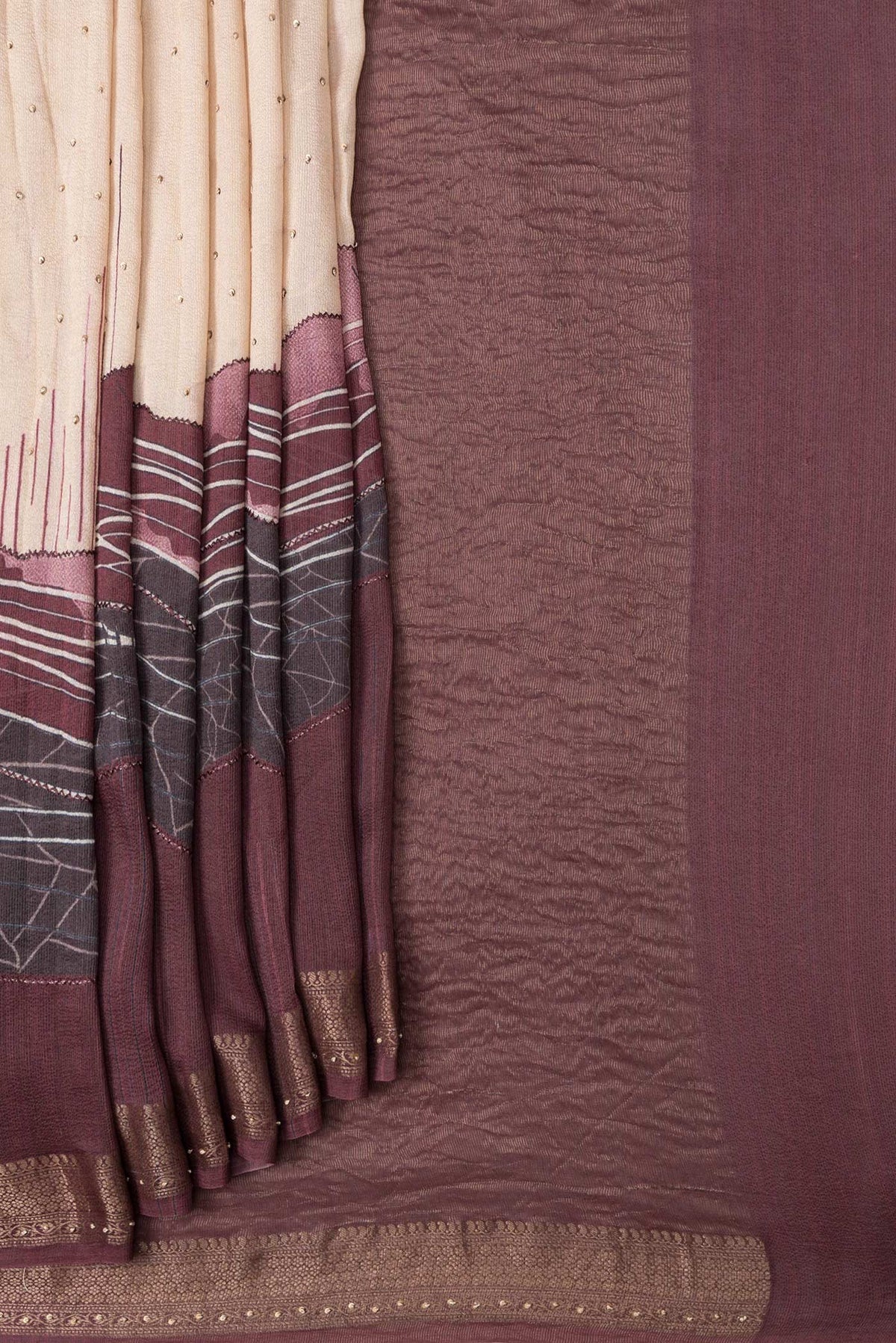 Pleats and pallu of Maroon Dual Tone Tussar Silk Saree with Embroidery on the body and Embroidery Border. 