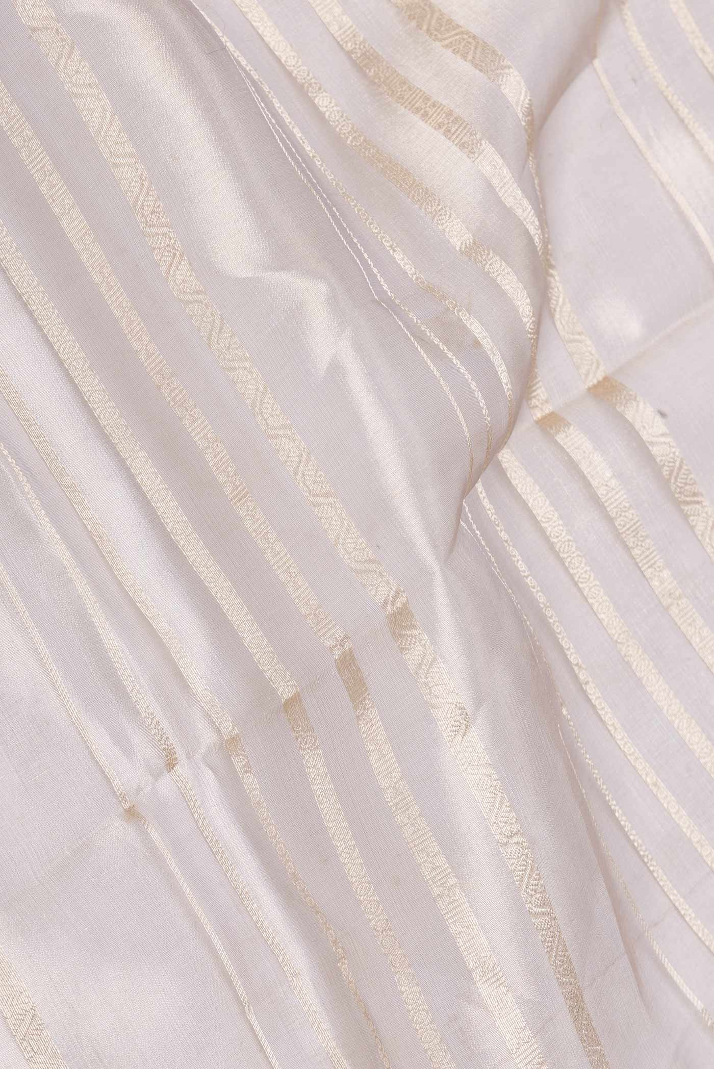 Close up of Grey Dual Tone Organza Silk Saree with Stripes on the body and Zari Border displaying folds