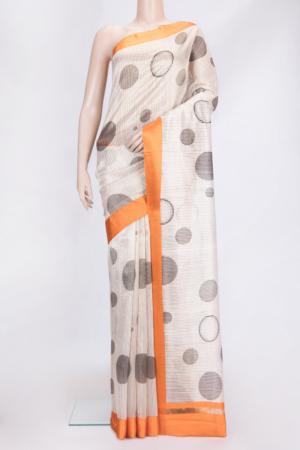 Beige Dual Tone Tussar Silk Saree with Stripes on the body and Plain Border.  displayed on a mannequin
