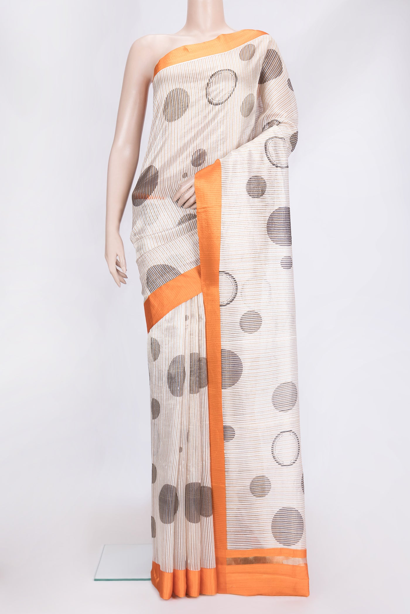 Beige Dual Tone Tussar Silk Saree with Stripes on the body and Plain Border.  displayed on a mannequin