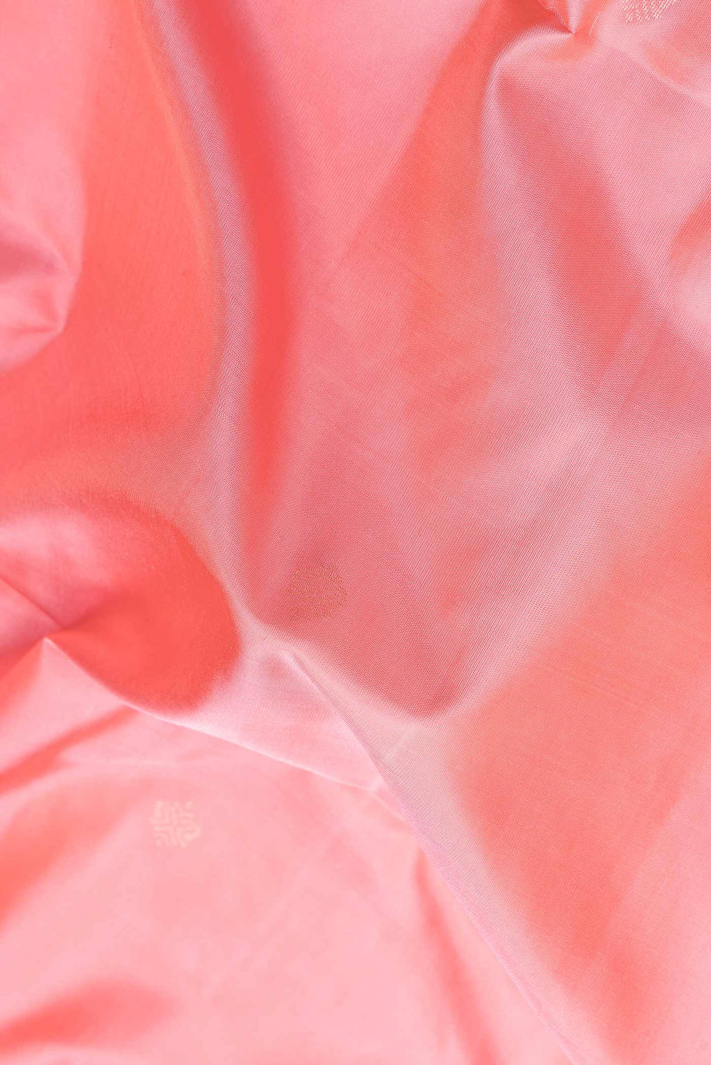 Close up of Pink Dual Tone Soft Silk Saree with Zari Butta on the body and Fancy Border.  displaying folds