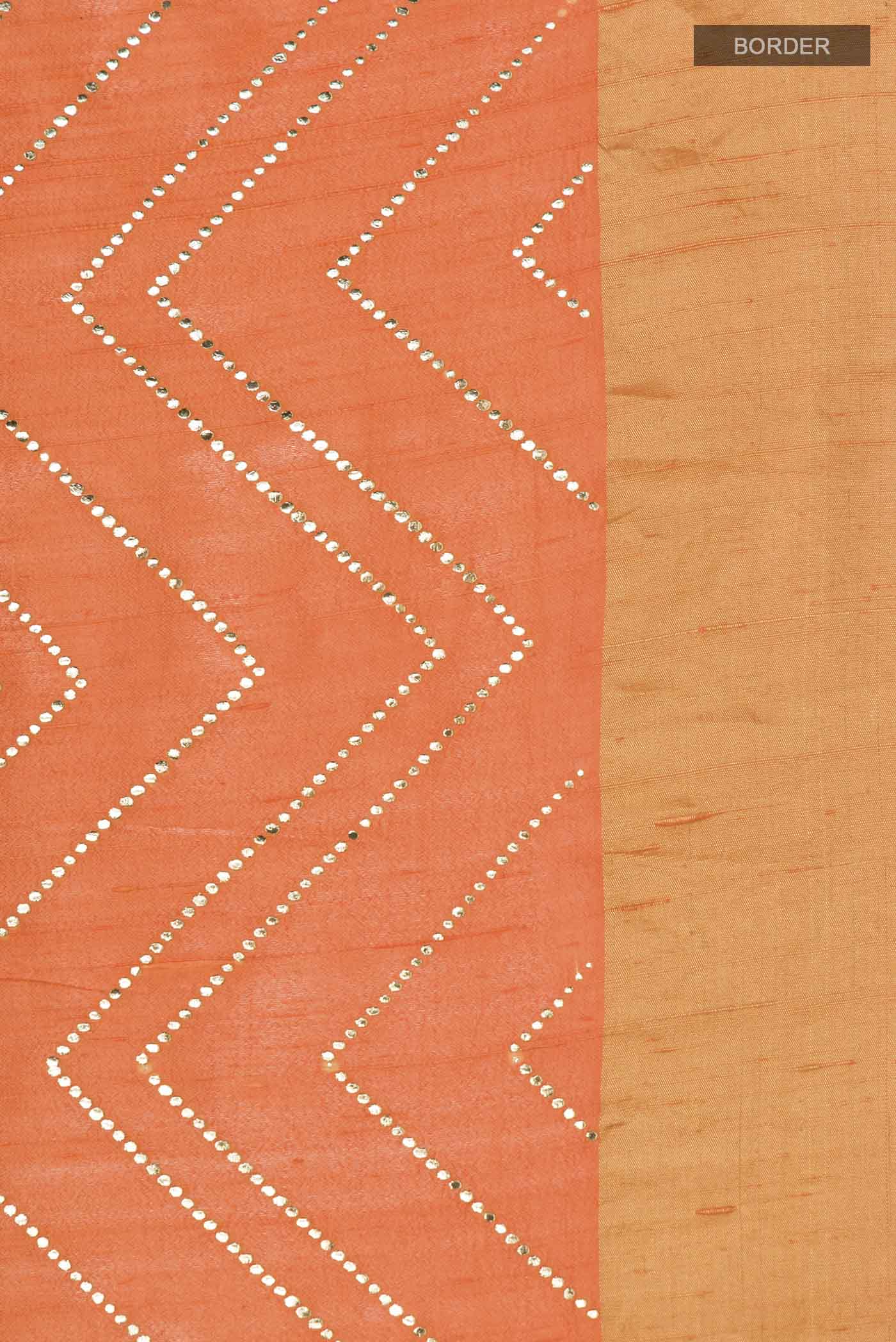 Border image of Orange Raw Silk Saree with Embroidery on the body and Zari Border